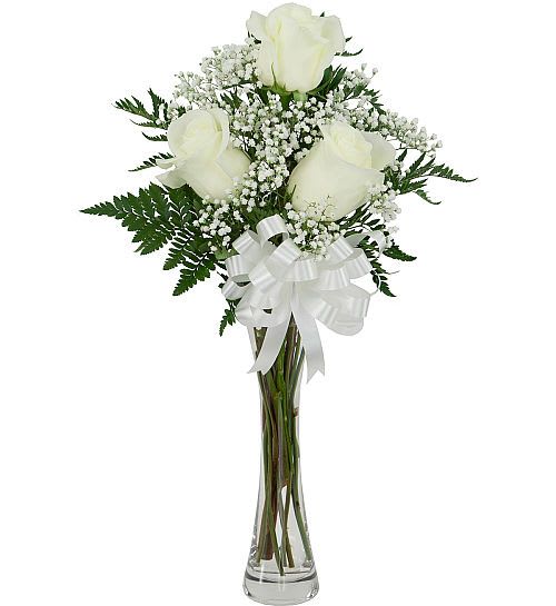 3 White Roses - A simple yet thoughtful and beautiful gift to express your sympathy. Three white roses are arranged in a slender bud vase with added baby's breath, greenery and  bow.