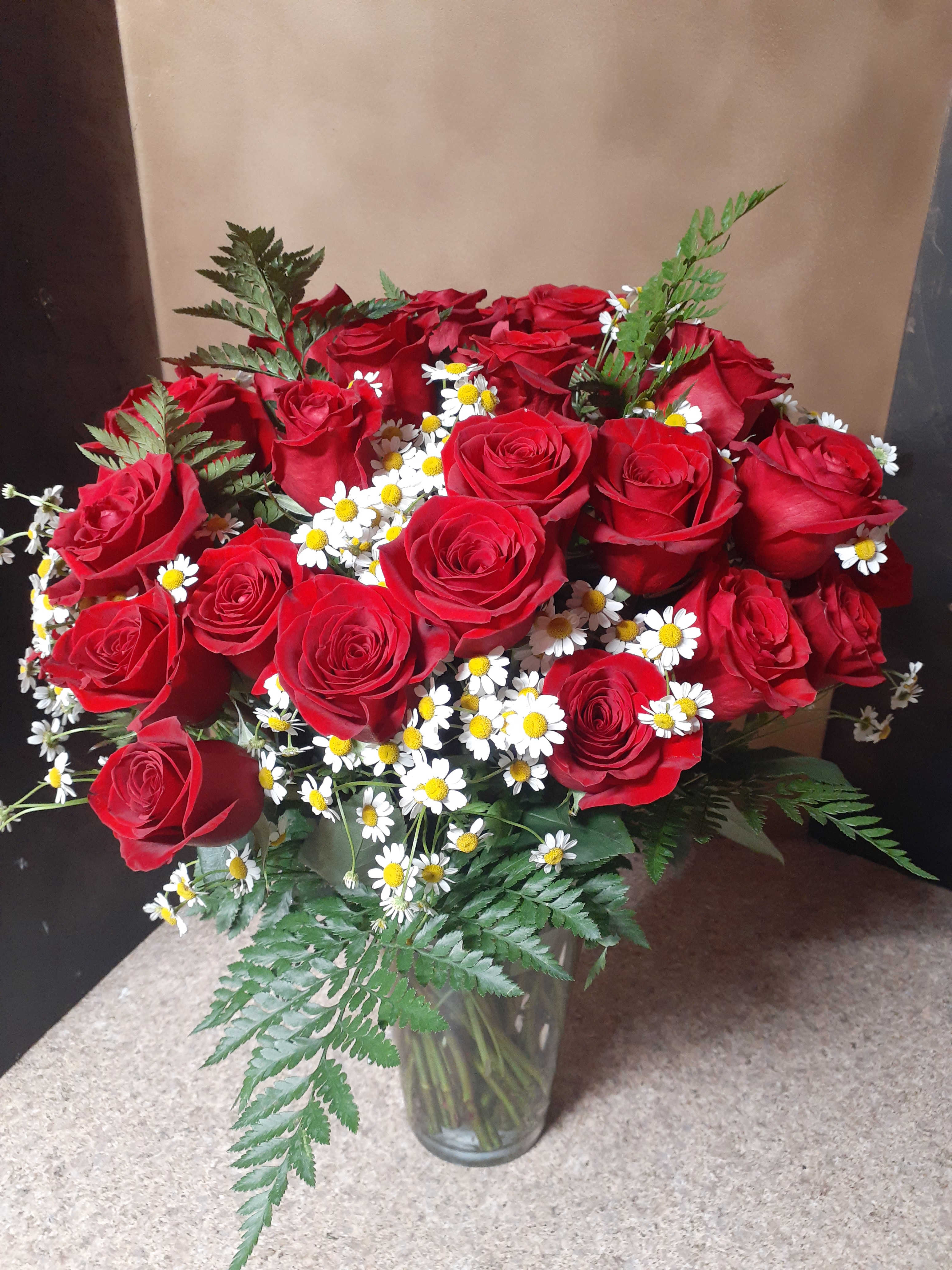 Love is - Giving , treat your loved one with 8 weeks of flowers - Delivered once a week Designer's choice vased arrangement