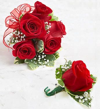 Red Spray Rose Corsage and Boutonniere Red Spray Rose Corsage and Boutonniere - Beautiful hand-designed corsage arrangement of red spray roses, accented with fresh greenery Designed to be worn on the wrist