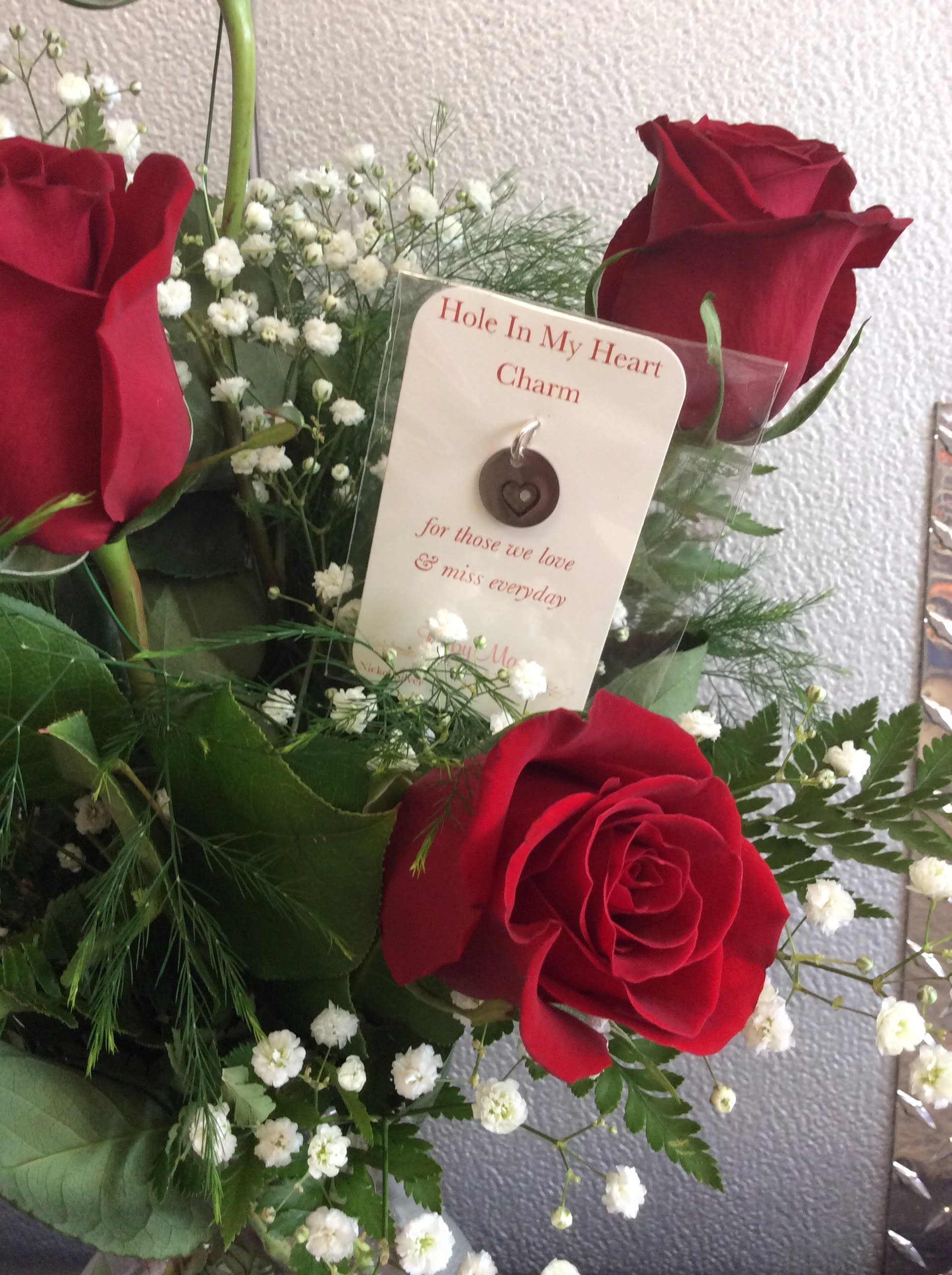 "Hole in My Heart" Roses "Hole in My Heart" Roses - Beautiful Red Roses w/ "Hole in my Heart" Charm included. Thoughtful gift for someone who has lost a Loved one.