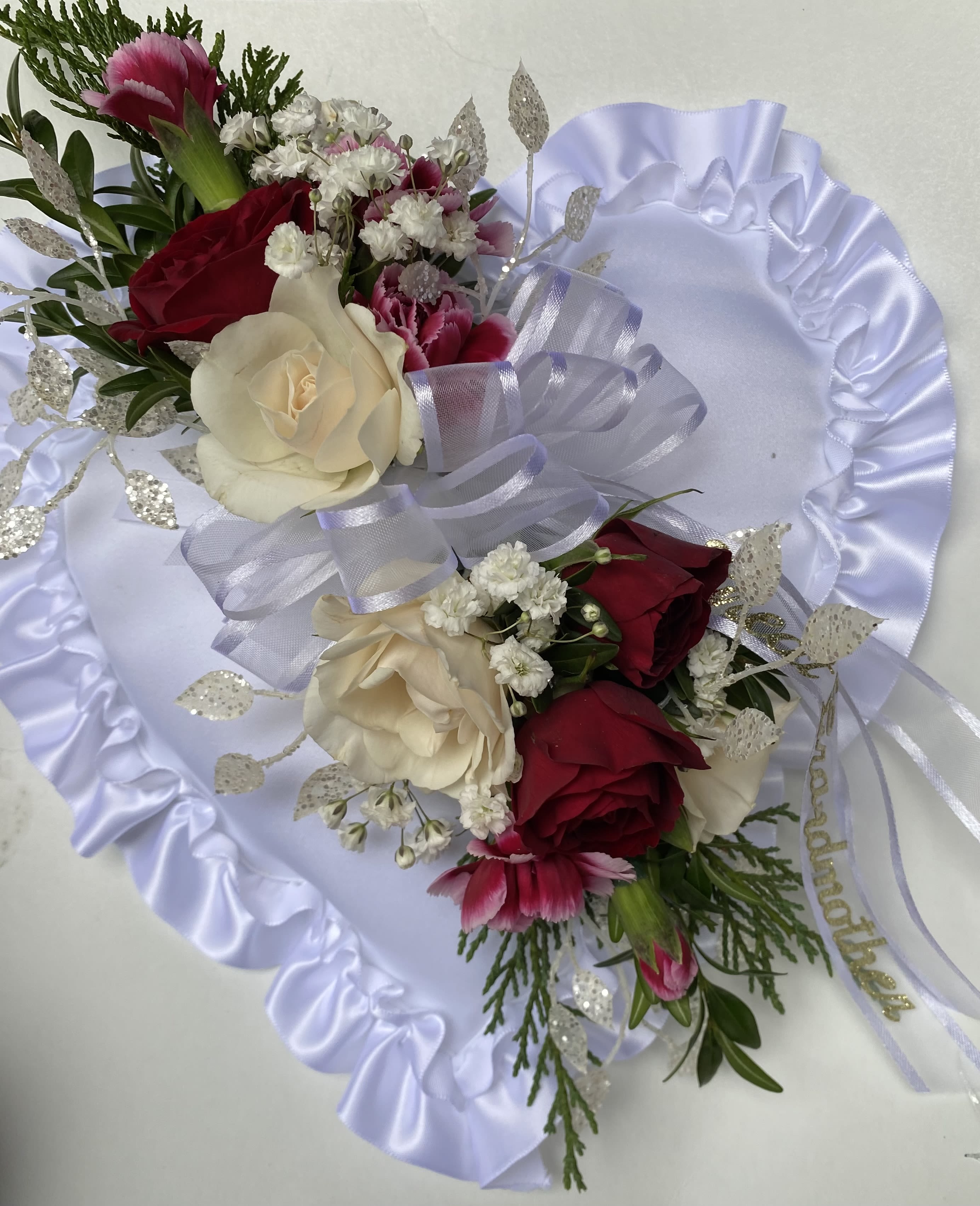 Satin Heart Casket Pillow - Satin pillow with spray roses and other filler flowers