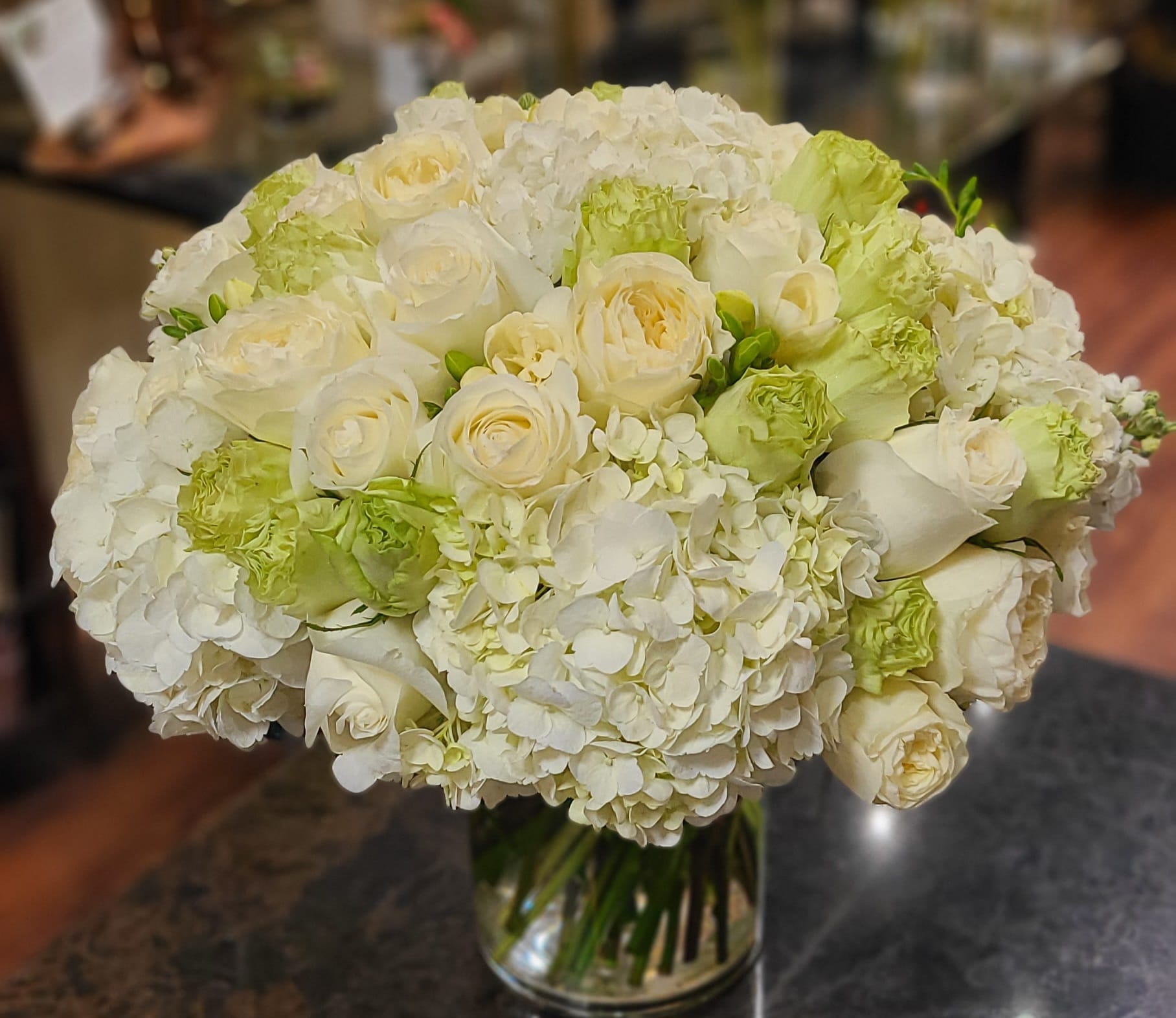 Voluminous lushness - This arrangement is packed full of garden roses and complimentary textures that add to it's luxurious beauty. The arrangement is 360, and is approximately 18&quot; high by 18&quot; wide. No filler whatsoever!