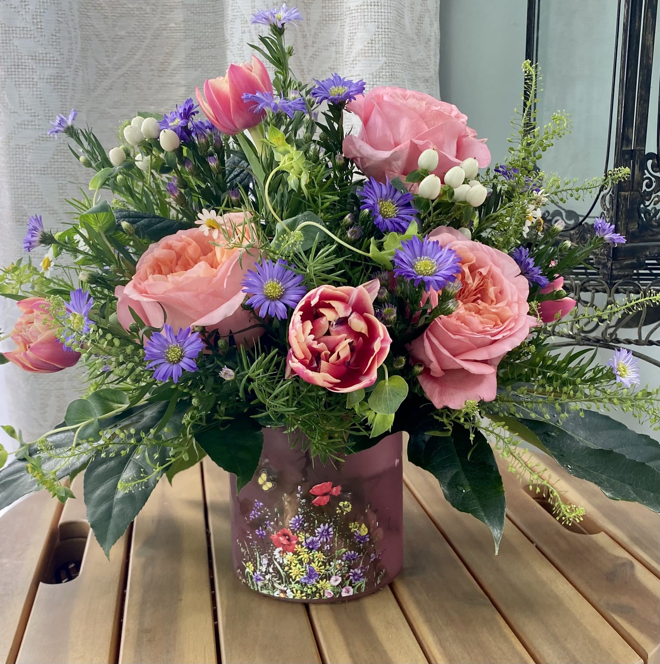 Muah - A beautiful frosted vase with flowers designed with free spirit roses, double tulips, purple asters and white hypericum
