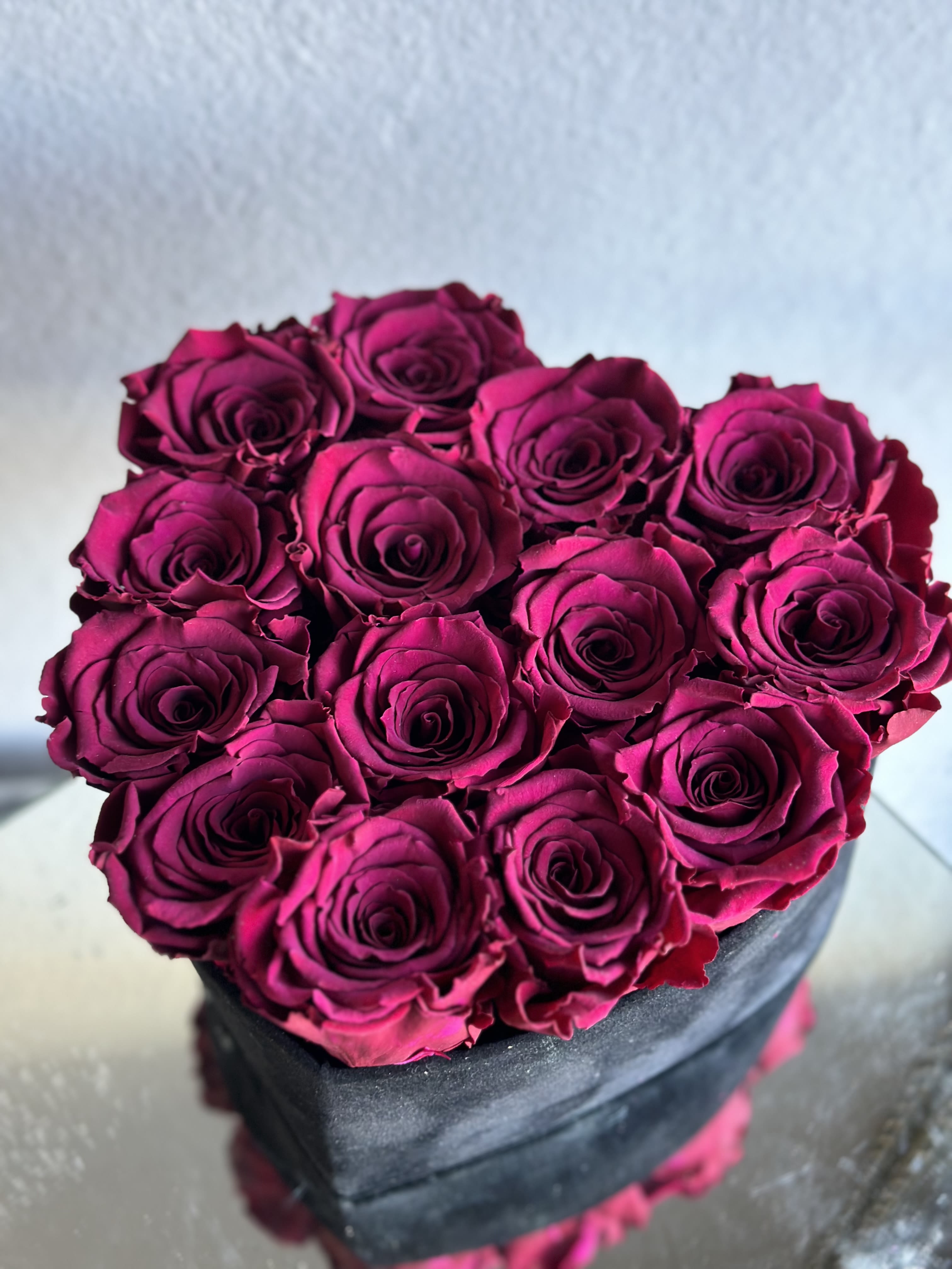14 dark Fuchsia preserved roses heart box  - Dark, fuchsia preserved roses, placed in a velvet black heart shaped box