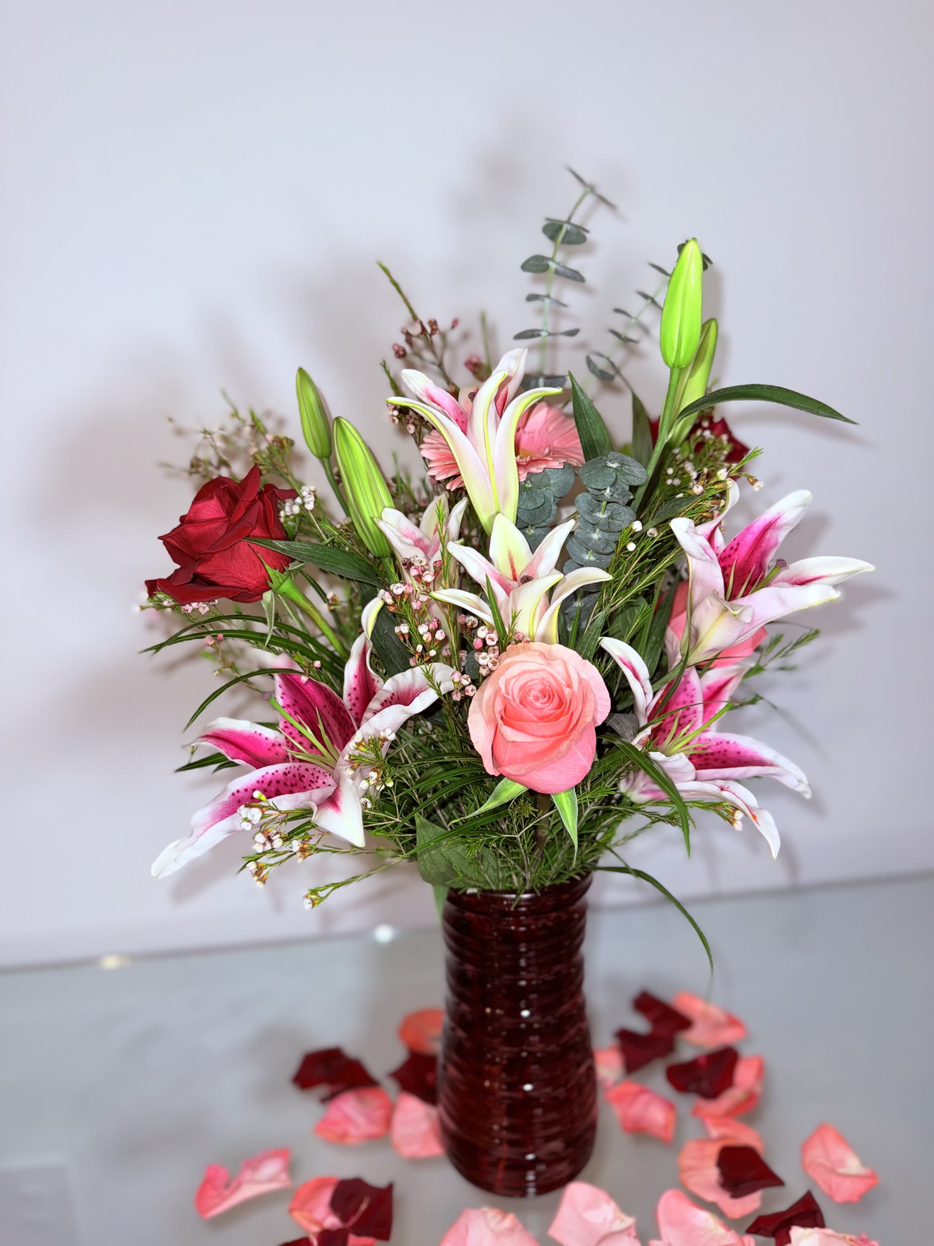 Lily's Trash Lily's Trash - A beautiful gift where they combine to form a fun and elegant bouquet with Lilys, roses and wax flower