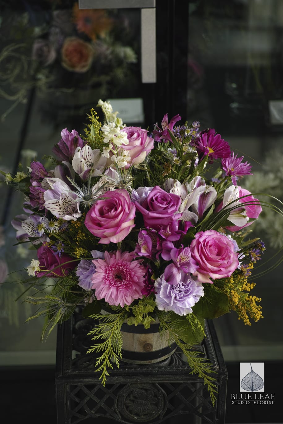 Simply You - An all purple palette with gerberas, roses, daisies, alstromeria and carnations in an old fashioned barrel.