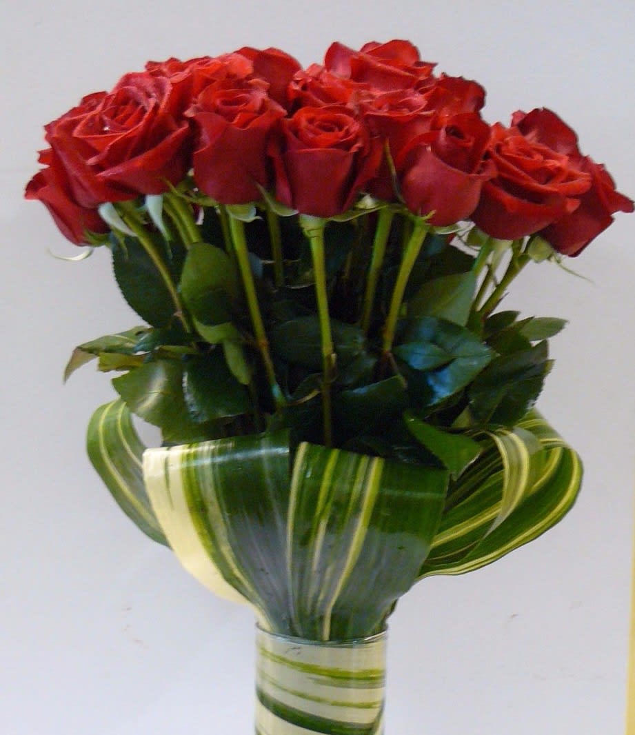 Sleek European 2 Dz Long Stem Rose (Pick Your Color) - 2  Dozen Long Stem  Red Roses , Fancy Greens  in a Cylinder Vase. Like a different color ? Call us so we can order the Roses.  908-234-2900    