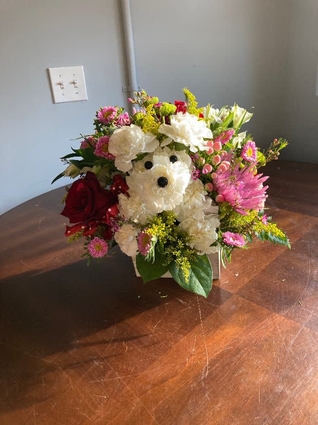 Puppy Love - A dog made out of an assortment of flowers in a wooden cube