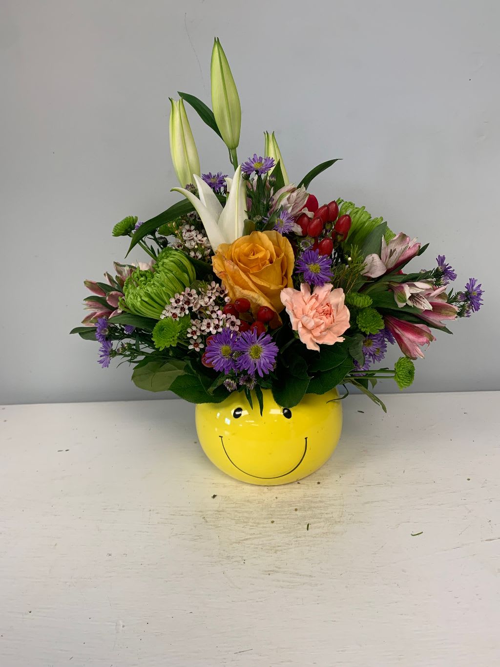 smiles for you - bright and cheery arrangement. sure to brighten anyones day. with mixed assorted seasonal flowers... may vary from picture
