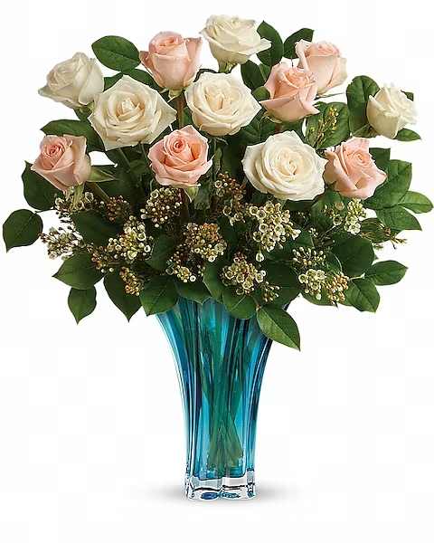 Ocean Of Roses - Celebrate her with an ocean of 12 radiant roses! Presented in an alluring azure vase with dramatic swirled shape, it's a gift she'll never forget