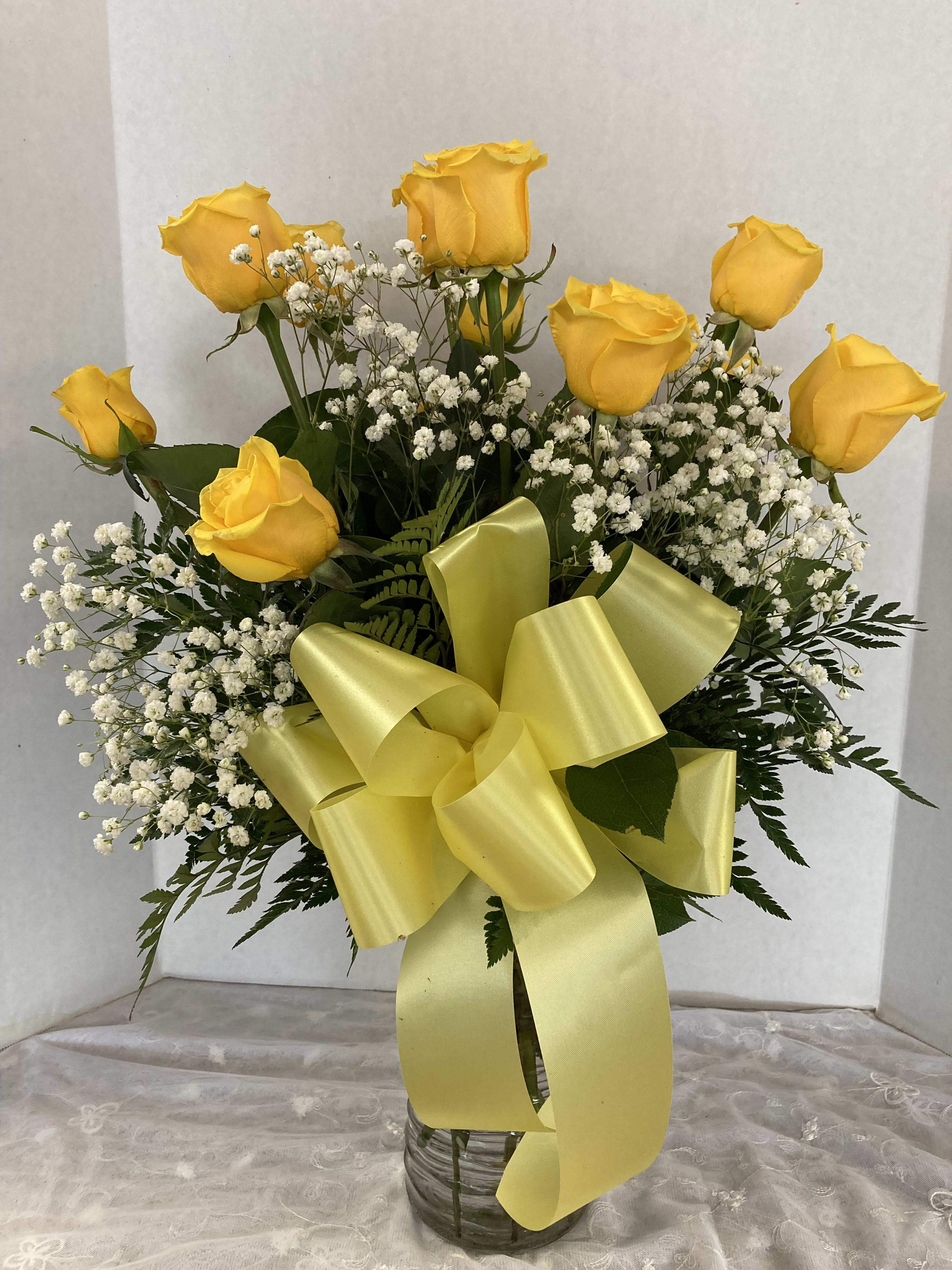 Sunny Yellow Roses by Candlelight &amp; Roses - A dozen yellow roses with fresh greens &amp; a bow - sunny &amp; bright!!   Deluxe is 18 roses, premium is 2 dozen roses!!