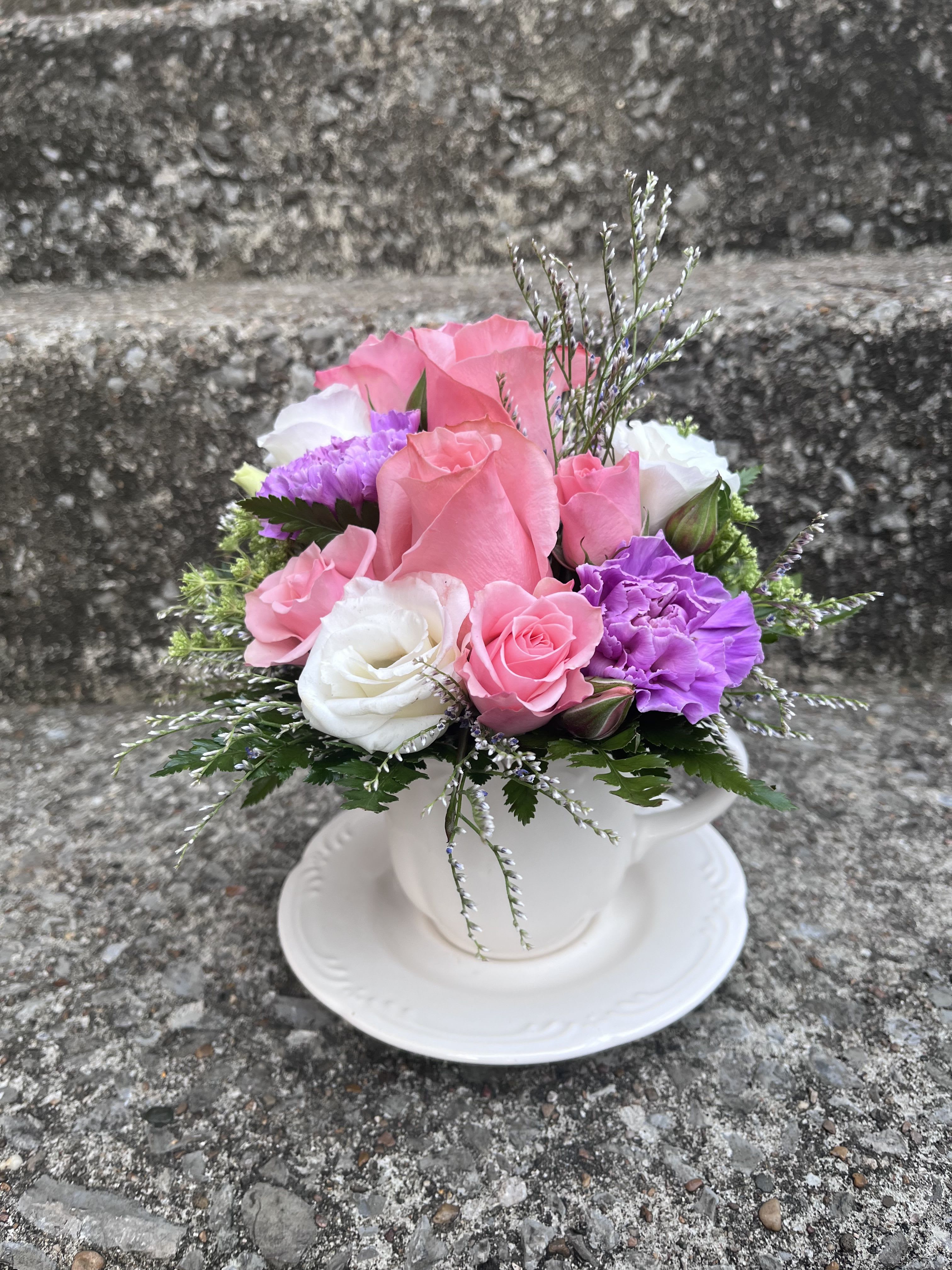 Poppin’ Pink Tea  - This arrangement has roses, spray roses , limonium , lisianthus, queens Ann lace, carnations and greenery.