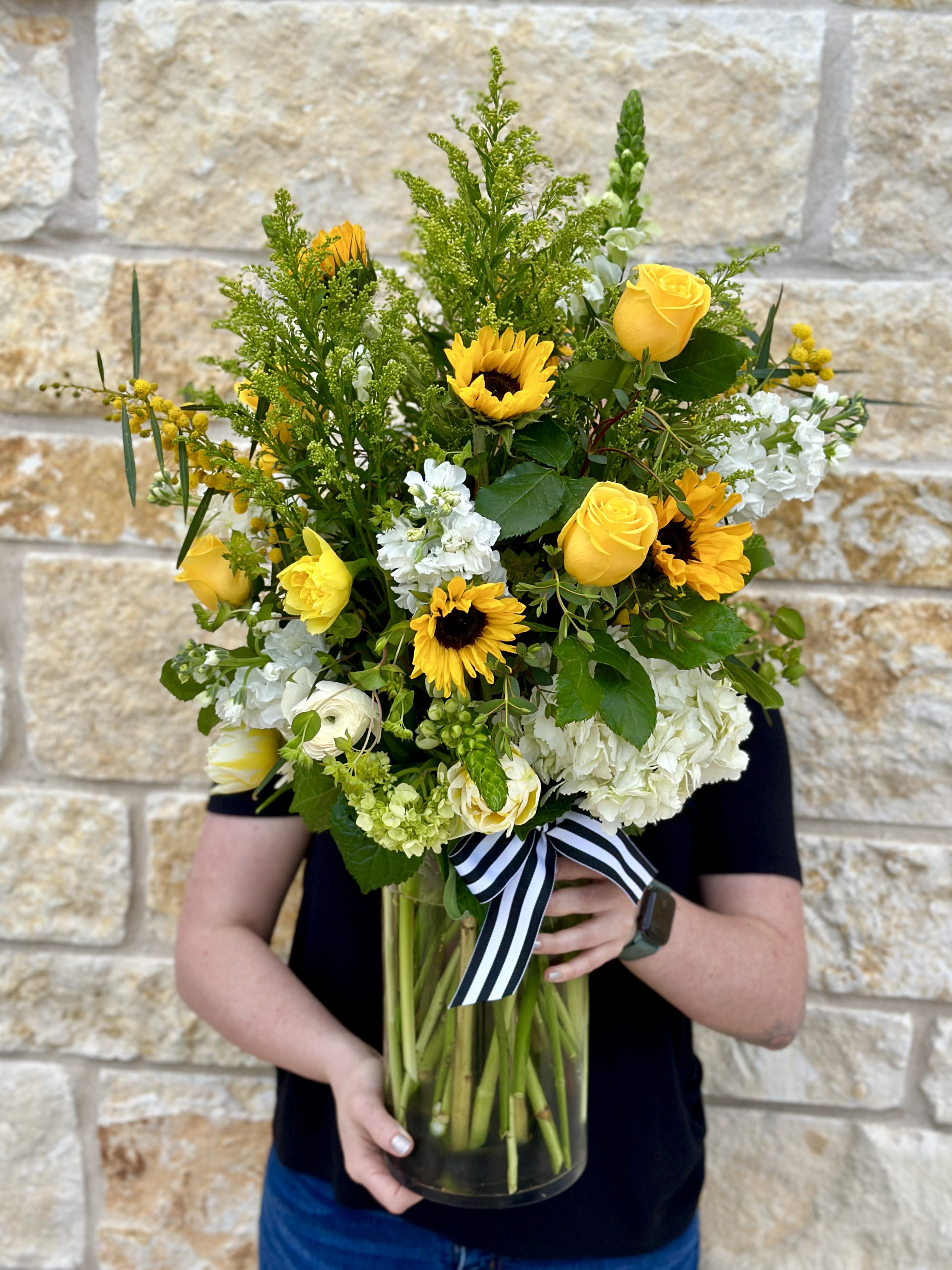 Tall Sunny Garden  - A cheerful garden of Sunflowers, Hydrangea, Stock, Roses, and seasonal foliage. Designed in a clear glass vase. Approximately 24&quot;H x 15&quot;W  Pictured as DELUXE 