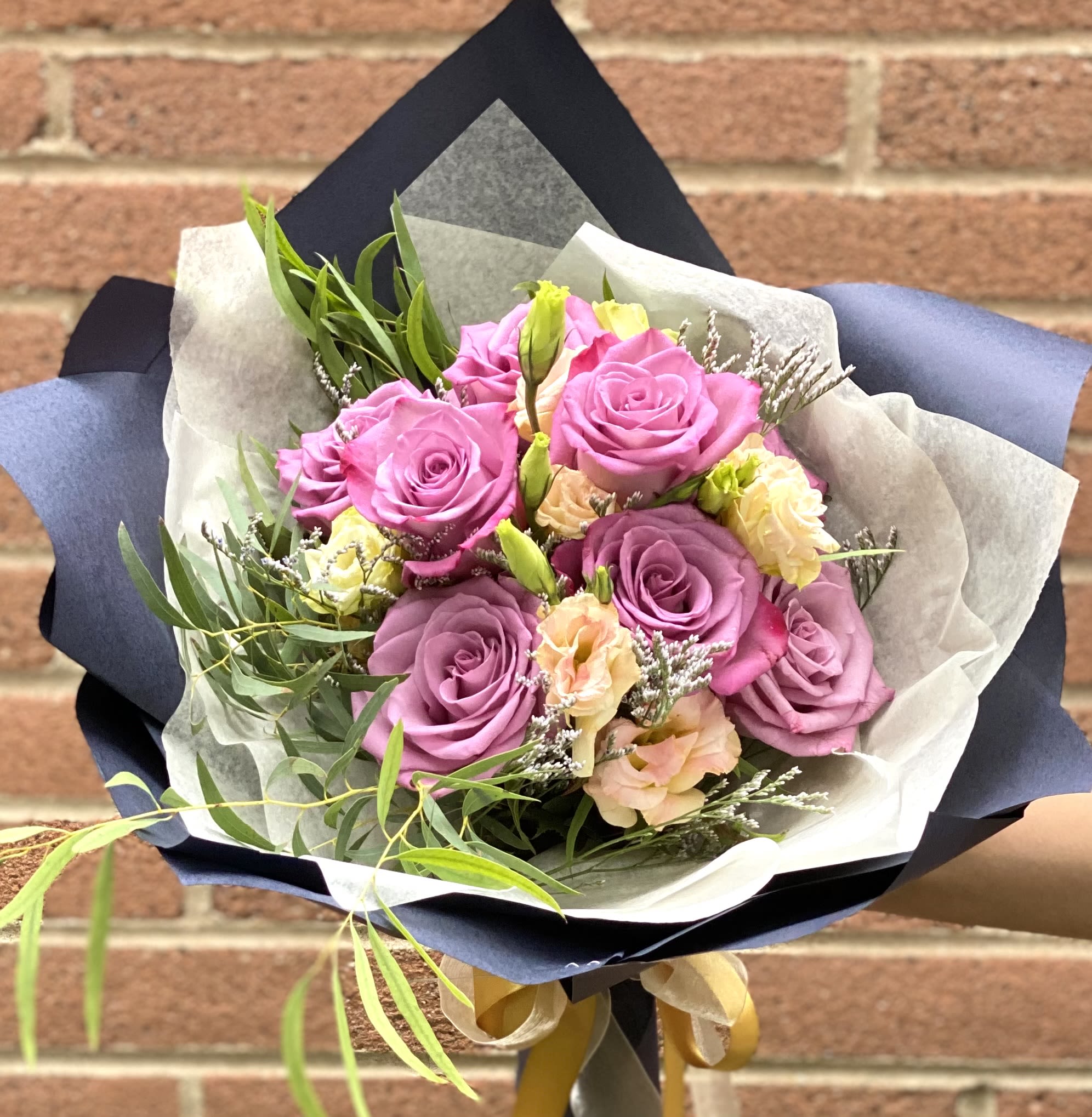 Elegant / Wrapped bouquet (Design of the day)   - The designer will select only the best flowers of the day to create arrangement or bouquet inspired by the seasonal beauty of the flowers.   PLEASE NOTE: The flower selection in the picture is for the design sample and to represent the sizes. The selection of the the flower and color schemes will vary due to seasonal availability.