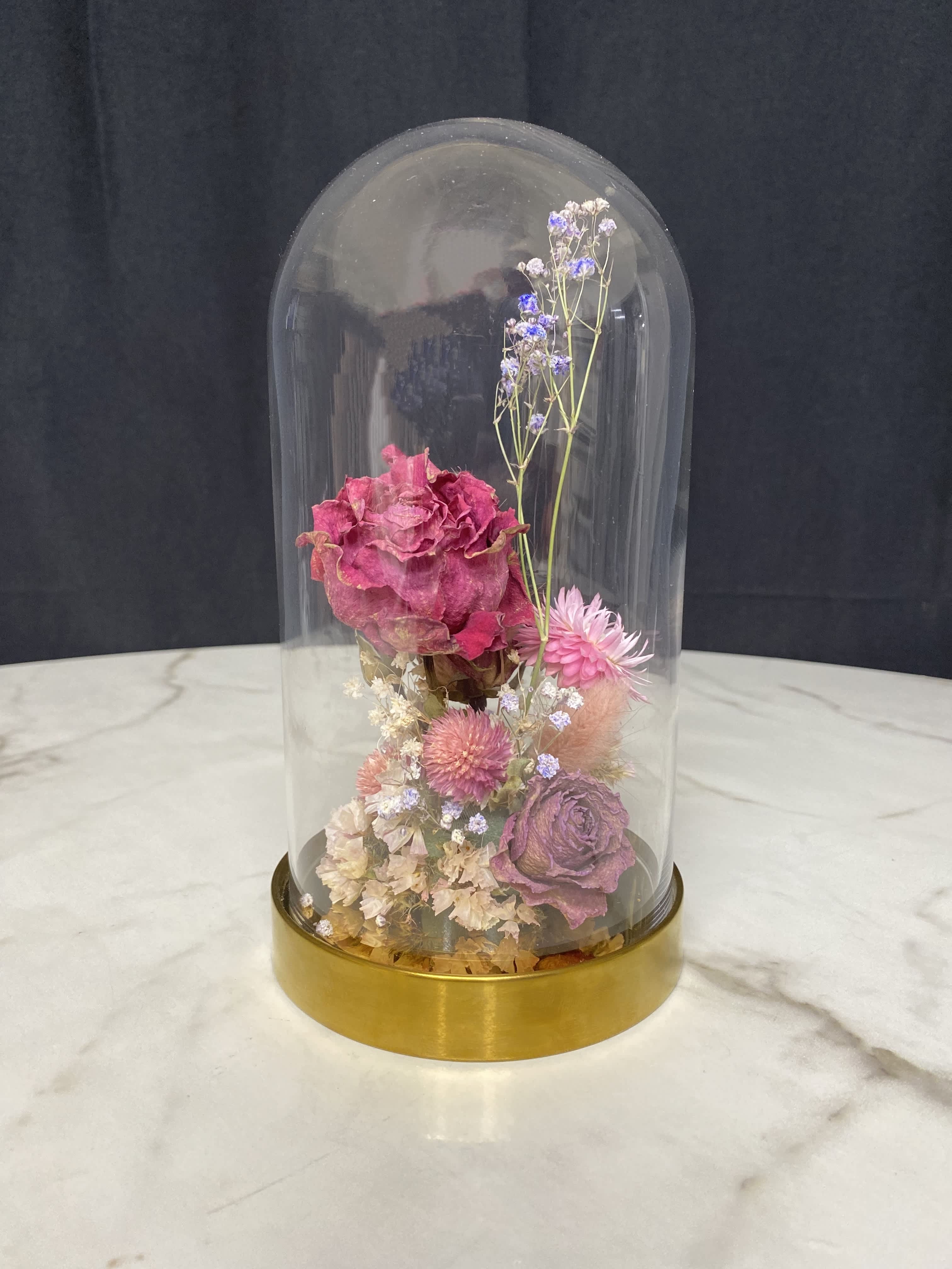 Dry Flowers in Glass Dome - Red  - Enjoy long lasting beauty of dry flower arrangement H: 10 3/4” x D: 5 1/2” Selection of the flowers may change due to availability of the dry flowers