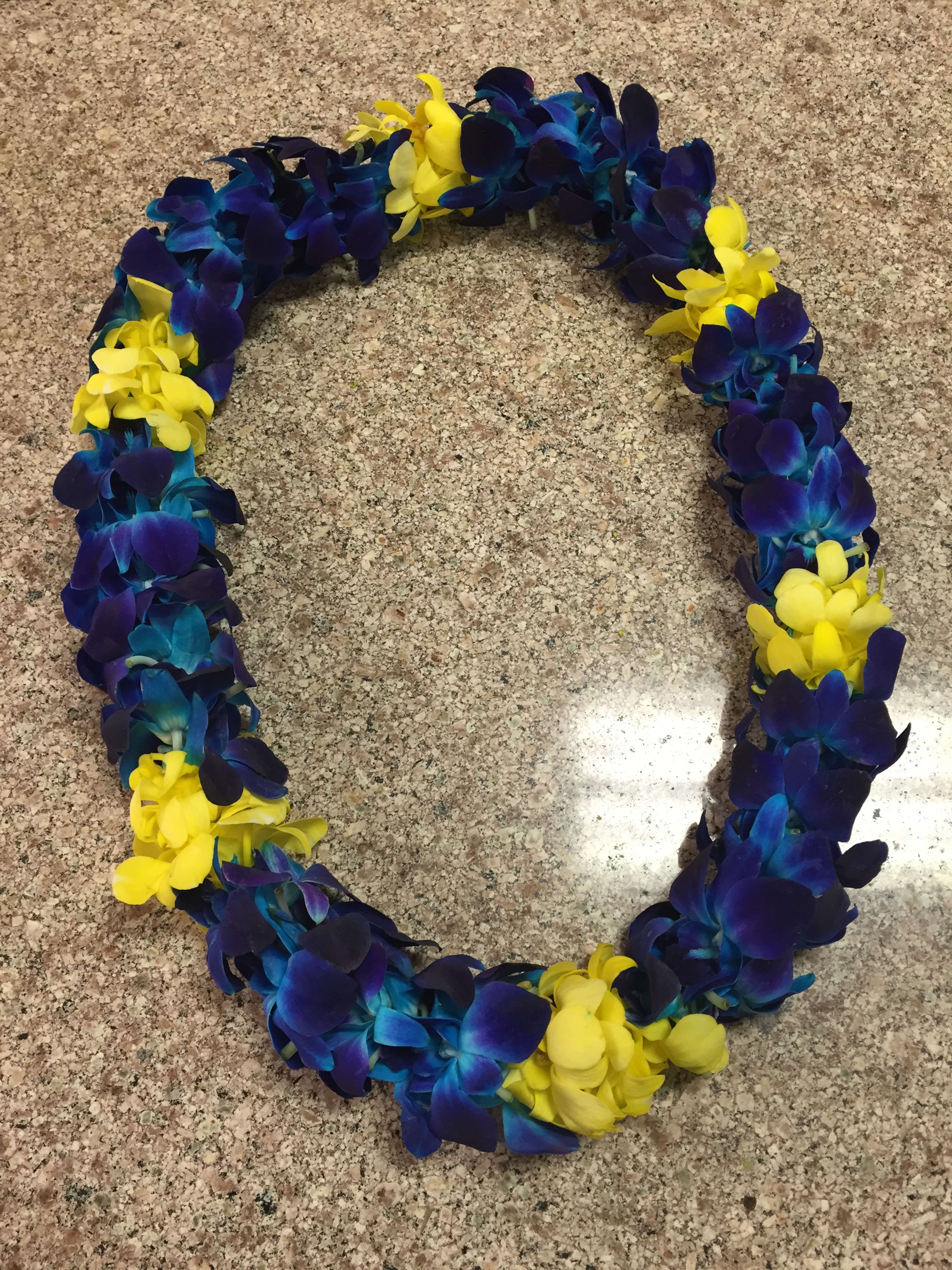 Lei 5 Lei 5 - This orchid lei make with dendrobium orchid, it have different color like purple, white, blue, yellow or two tone color
