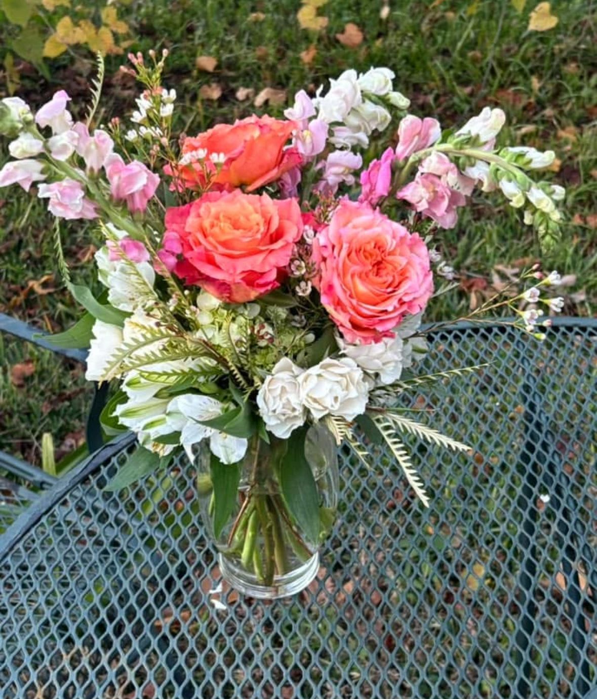 Blushing Sunset Blooms  - Roses, snapdragons, spray roses Product colors may change depending on availability. Look and feel will the same. 