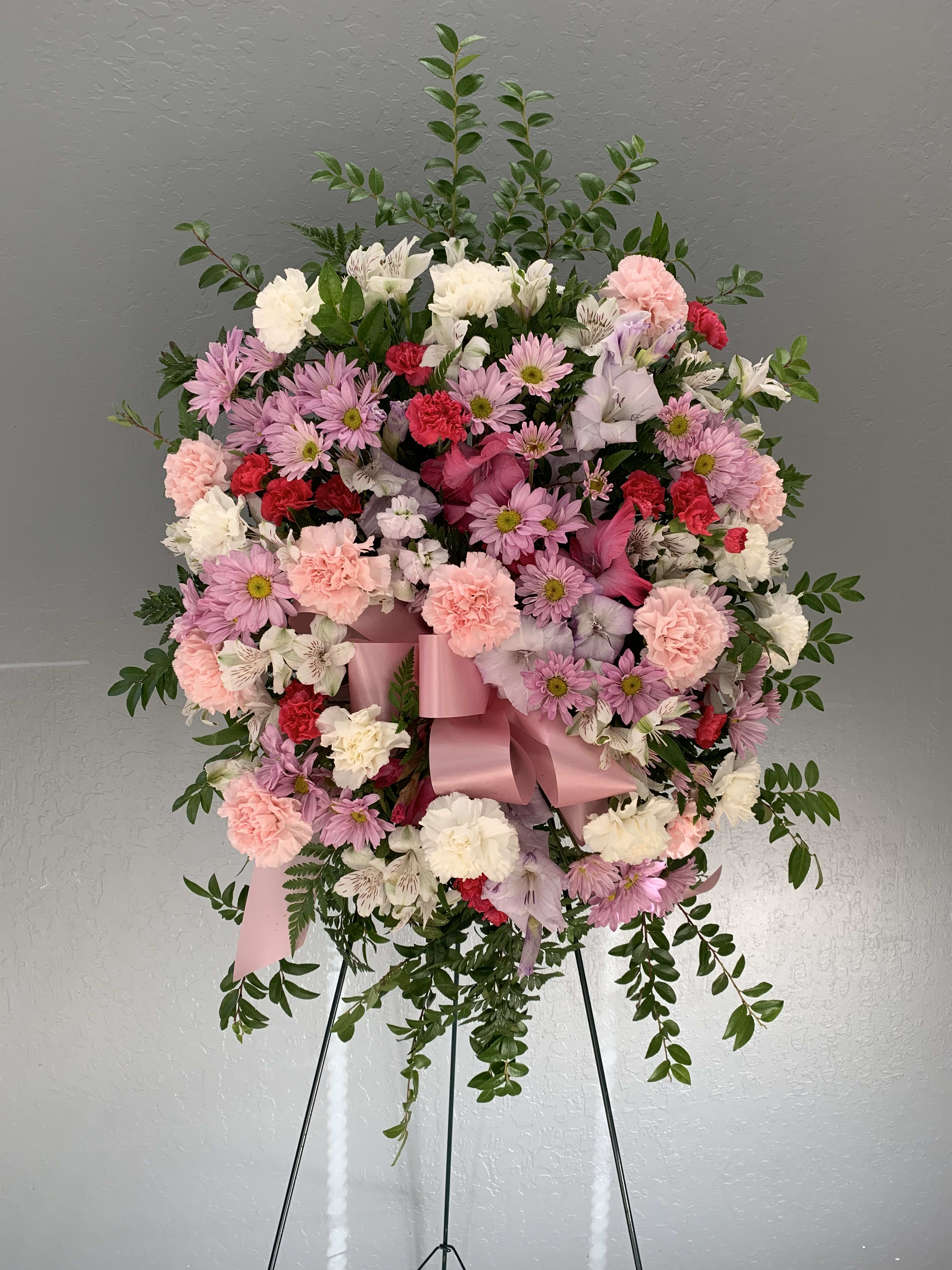 PS#02 Pink and White - Petite - A petite rendition of our standing sprays in pink and white featuring carnations, daisies, alstroemeria, gladiolus, and mixed foliage.   The arrangement is approximately 36&quot; H and 24&quot; W.