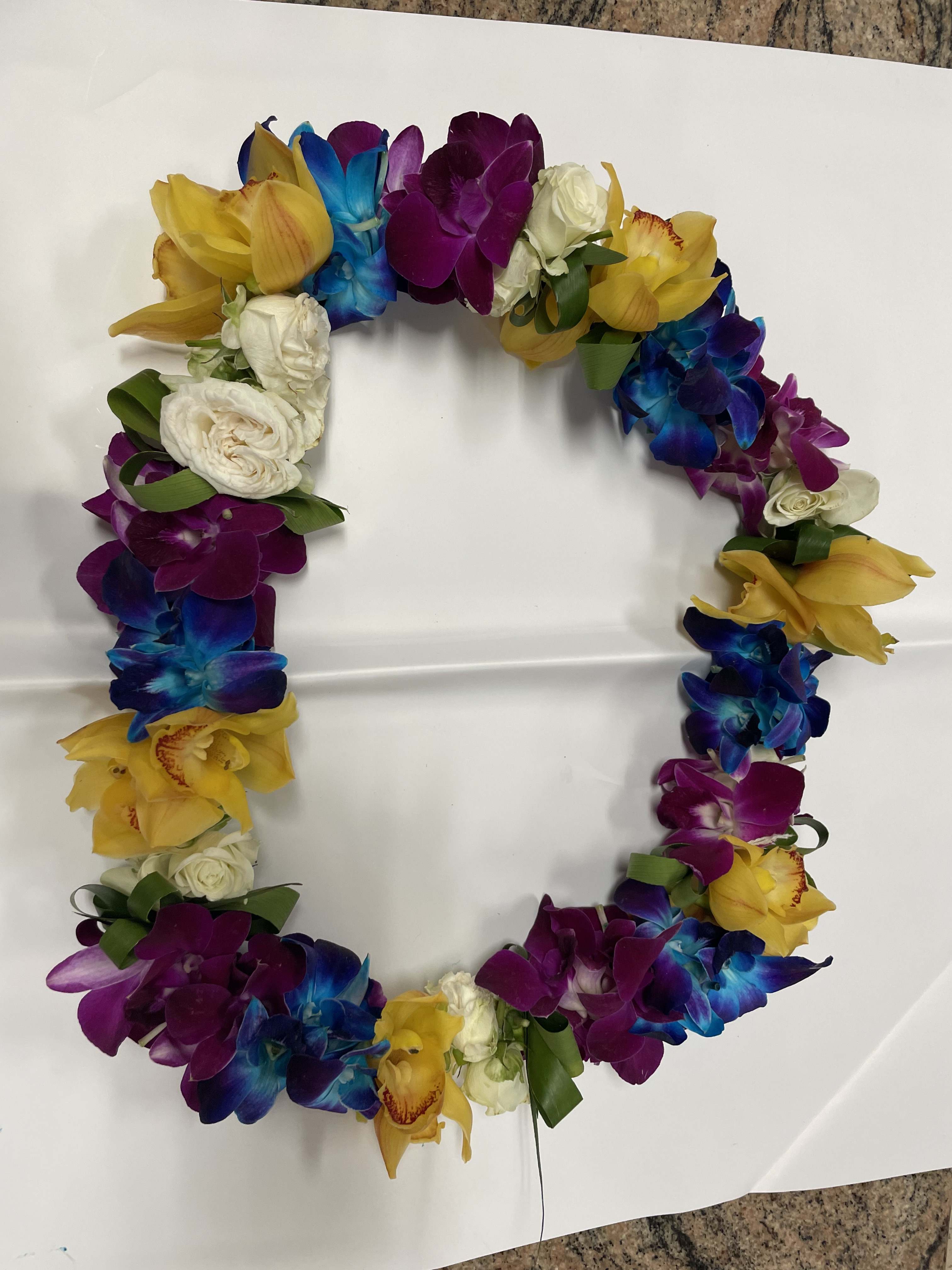 Orchid and Orchid Lei Orchid and Orchid Lei - This beautiful lei make with yellow cymbidium orchid , blue and purple dendrobium orchids and 20
