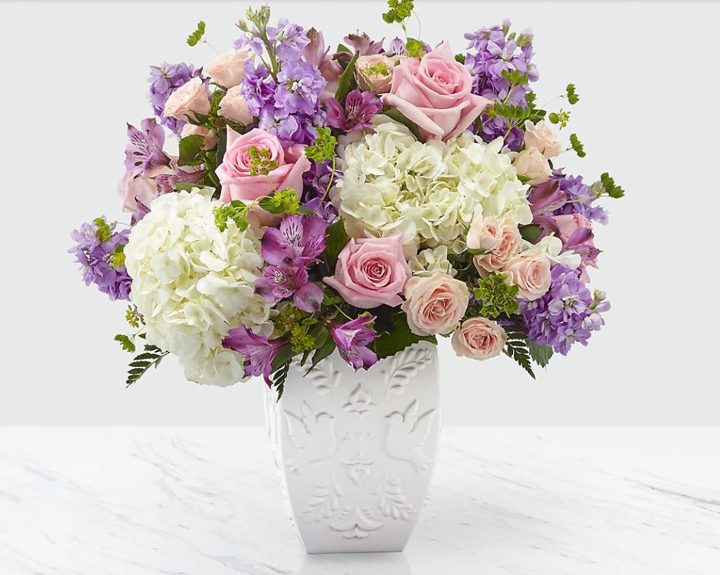 Peace and Hope ™ Lavender Bouquet - We know that saying farewell to a loved one is often a celebration of life. Our Peace and Hope™ Bouquet sends thoughtfully shares your love with its combination of a lavender color palette and an elegant array of roses, stock, hydrangea and alstroemeria. Good bouquet is approx. 15&quot;H x 16&quot;W. Better bouquet is approx. 17&quot;H x 18&quot;W. Best bouquet is approx. 18&quot;H x 20&quot;W. 