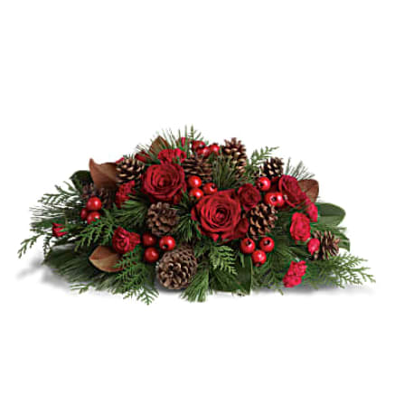 Spirit of the Season - Red roses, red berries, Christmas greens and pinecones - yep, it's Christmas alright! This beautiful Christmas floral centerpiece adds seasonal spirit to the dining room table, the mantle or your entryway where it gives a festive welcome to your guests. Red roses and carnations mix with red berries, pinecones and seasonal greens such as white pine, flat cedar and magnolia leaves. Orientation: All-Around
