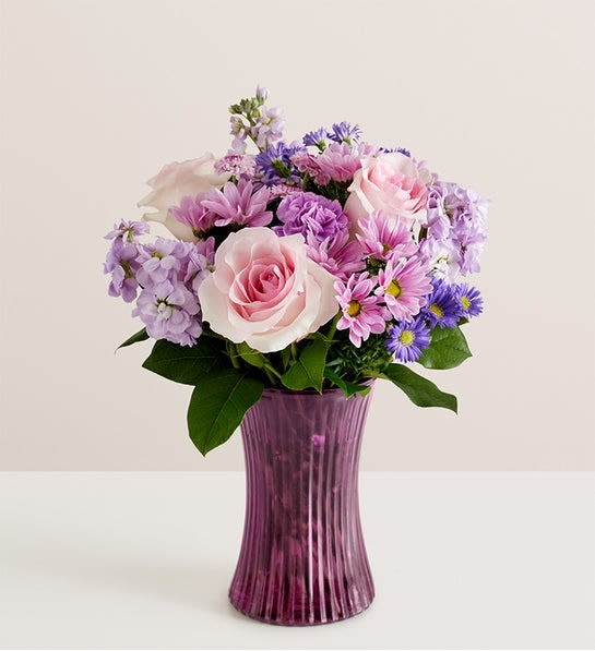 Daydream Bouquet - EXCLUSIVE Just like a daydream. Our delightful lavender bouquet is gathered with accents of pink and lush greenery in our striking fluted violet gathering vase. Designed in vintage pressed glass with ribbed detailing, it captures the rich beauty of the blooms, along with the thoughtfulness of your sentiment.