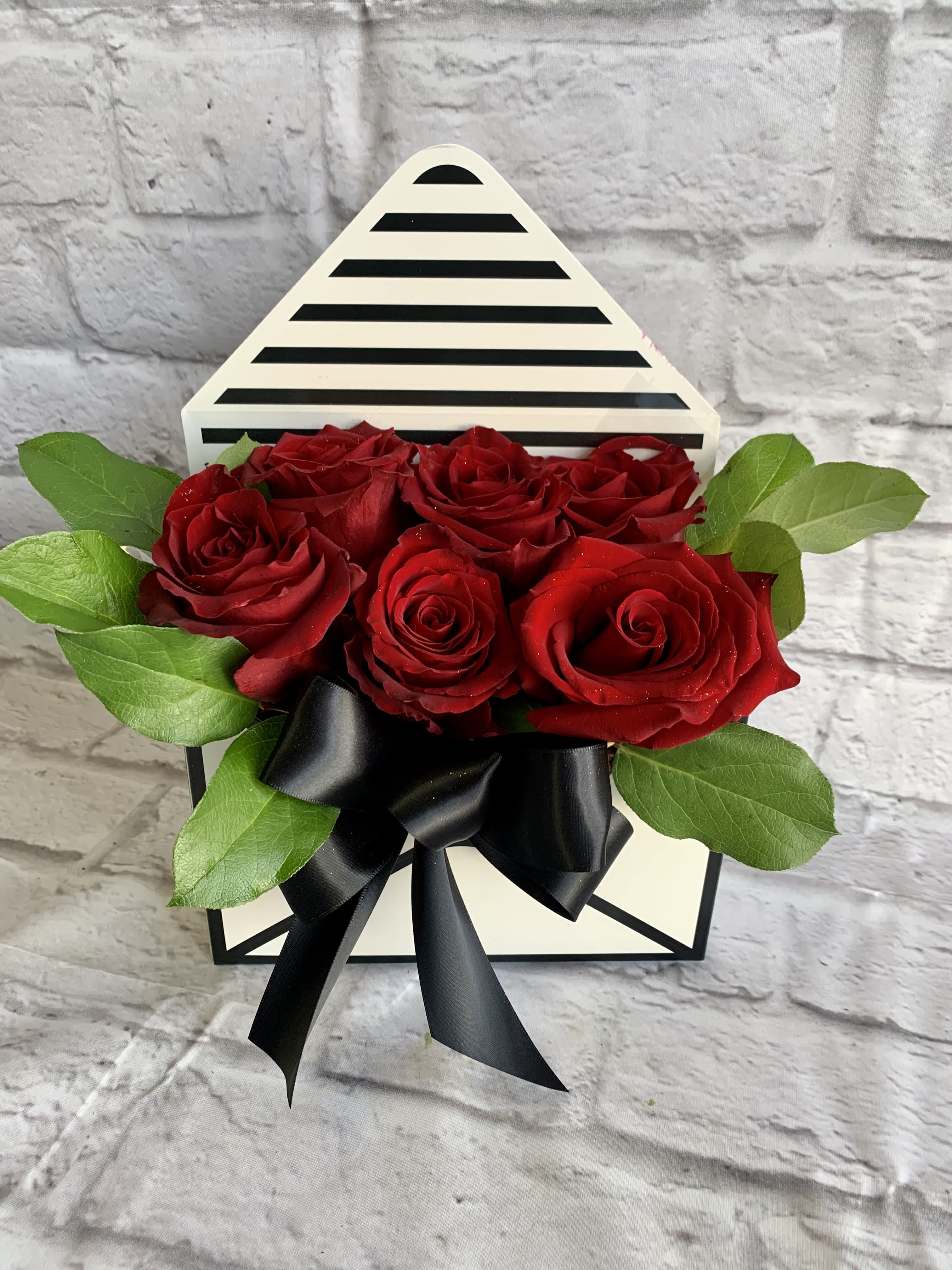 Under an Eclipse Under an Eclipse - A beautiful envelope of red roses. Radiance and brilliance, suggesting a state of brightness or shining light rather than darkness.