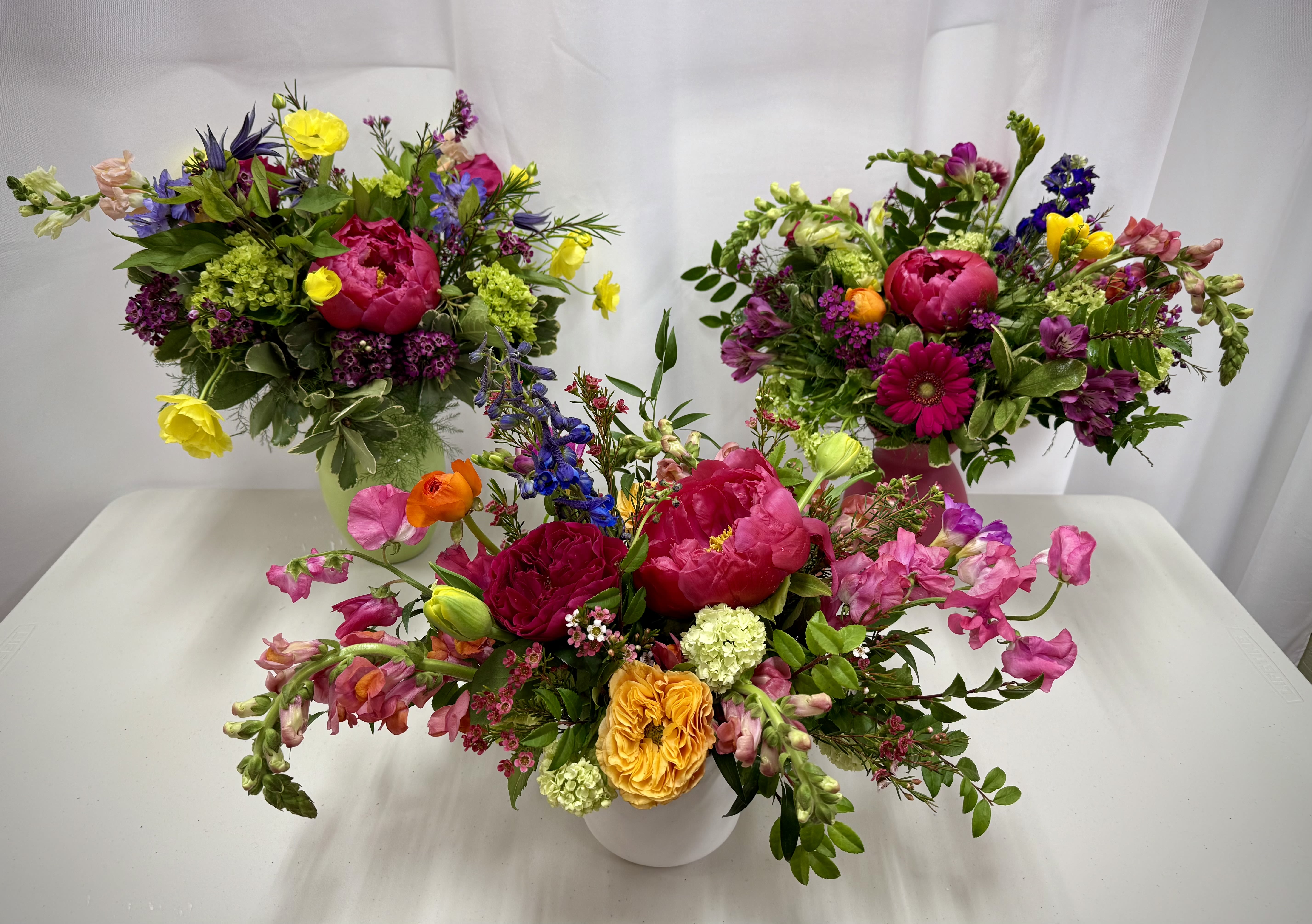 Bright and cheerful designers choice. Bright and cheerful designers choice. - Bursting with vibrant, color and joy, this bright and cheerful bouquet is sure to brighten the day of your loved one.
