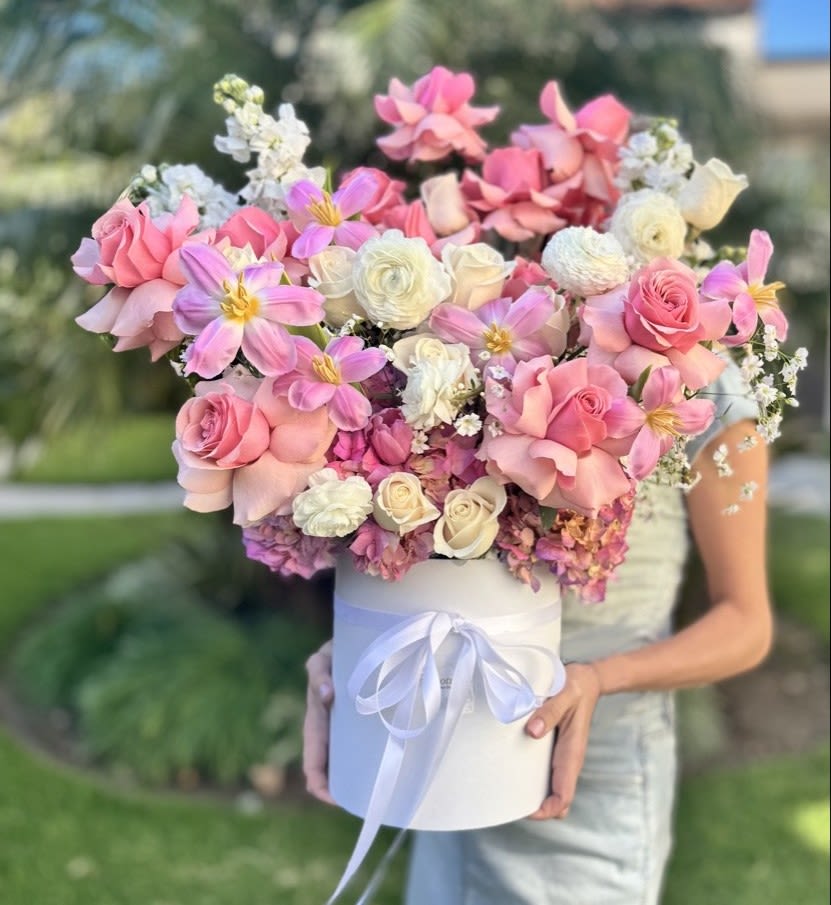 Elegant Pink &amp; White Bloom Box &quot;Royal Delight&quot; - Indulge in the beauty of this exquisite pink and white floral arrangement, elegantly presented in a sophisticated white hat box. This luxurious bouquet features a breathtaking blend of soft pink roses, delicate white ranunculus, charming pastel blooms, and lush textures, creating a romantic and elegant statement. Perfect for birthdays, anniversaries, weddings, or as a thoughtful gift for someone special. Handcrafted with premium fresh flowers, this stunning floral piece is available for same-day delivery in Los Angeles.