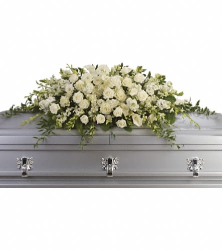 Purity and Peace Casket Spray Purity and Peace Casket Spray - Gather close for a moment of grace and reverence with this exquisite casket spray from Irvine Village Flowers. Envision a breathtaking tribute, crafted entirely in serene white while radiating quiet dignity and heartfelt comfort. This stunning arrangement is a perfect farewell that speaks of peace and eternal love that blends the timeless beauty of white roses, orchids, calla lilies, and hydrangea and gently accented by soft, trailing greenery. Picture this elegant scene: delicate white roses bloom with tender devotion, orchids lend their graceful allure, stately calla lilies stand tall with purity, and lush hydrangea adds a touch of soft radiance. Designed in a graceful crescent shape, approximately 47 inches wide, this spray casts a soothing glow and offers solace and serenity to all who gather. Each bloom carries a whisper of love, purity, and rest, creating a silent yet profound embrace for those left behind. This arrangement is a timeless gift—a lasting memory of beauty and comfort. Visit Irvine Village Flowers online or in-store and let us craft this peaceful tribute for you. With our heartfelt Irvine flower delivery, it will arrive fresh, radiant, and ready to honor a life with grace and solace.