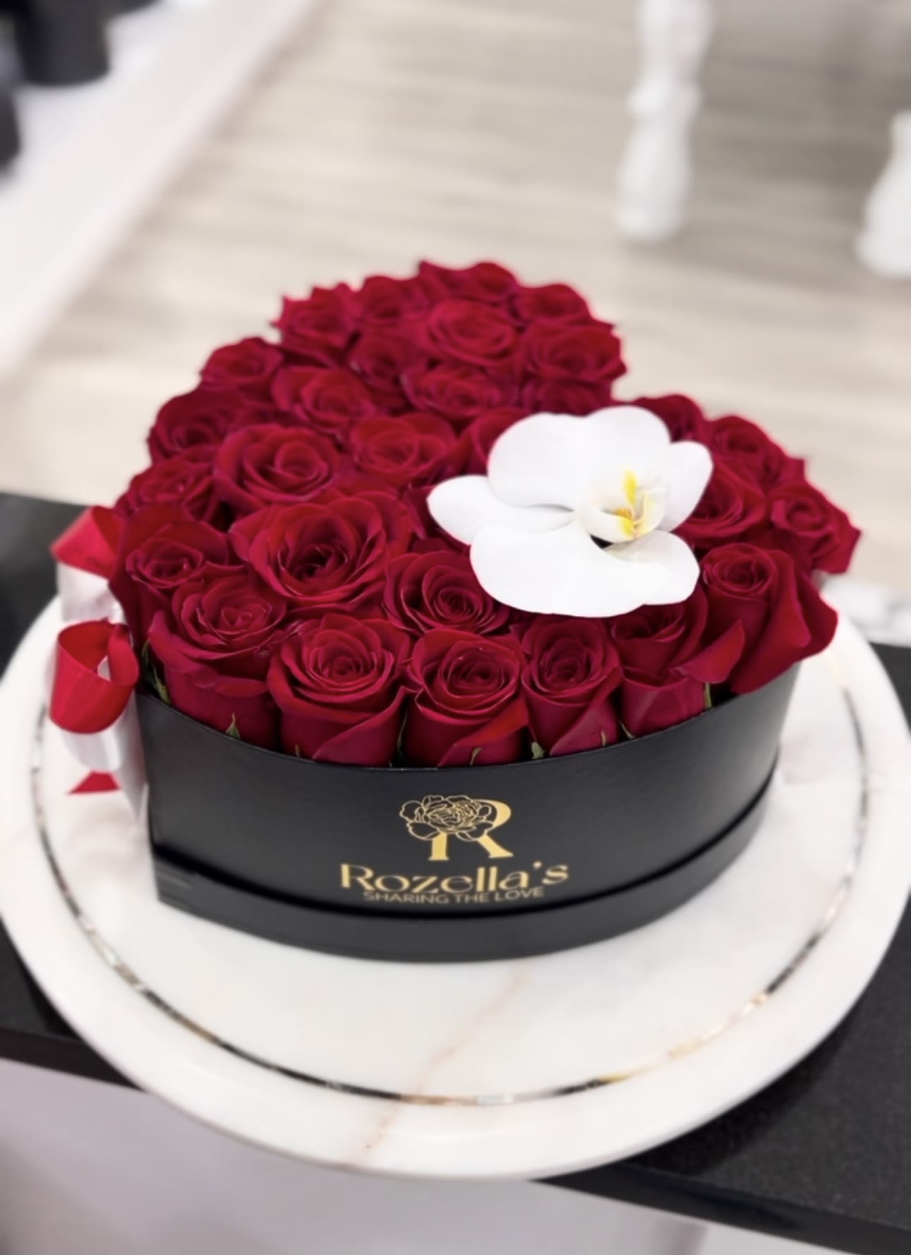 Heart Box of Roses Heart Box of Roses - Heart shaped box with our "Rozella's" logo, filled with red roses.