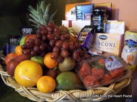 Overflowing Fruit and Gourmet Gift Basket  - Fresh fruit and gourmet products in a delicious gift basket presentation.  Our Deluxe version is pictured above.  