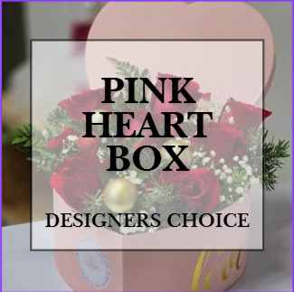 The Heart Box Designers Choice The Heart Box Designers Choice - A signature Love & Bloom piece, the Heart Box says love in not only the flowers but also the box! With the iconic red roses, some floral fillers, and stunning greens; this piece is perfect for all occasions! *Due to high demand, we only have extra large heart boxes available at this time. Sorry for the inconvenience.*