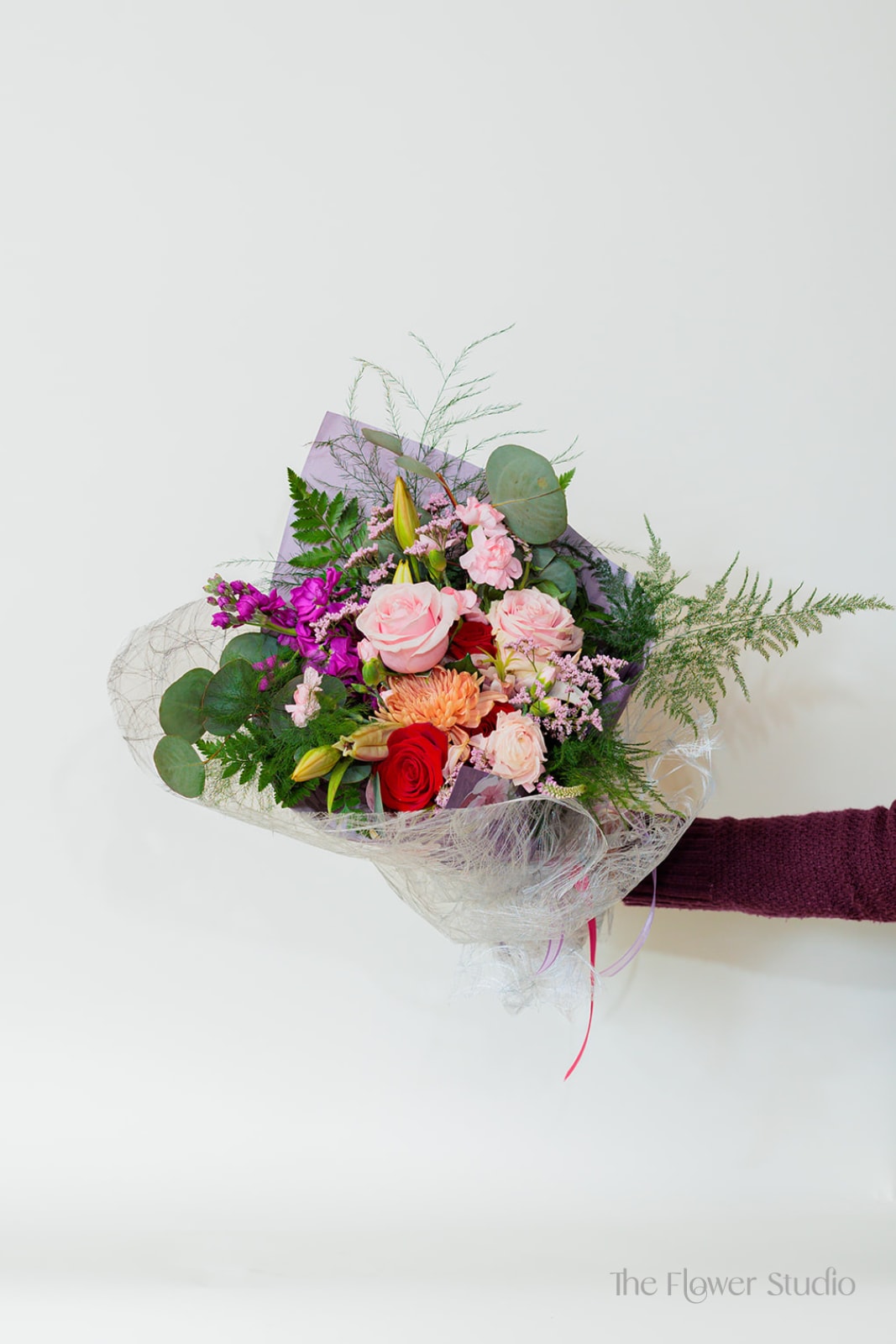 Wrapped in Romance - A very full styled bouquet wrapped in deluxe paper to create a perfect gift for someone who wants something more different than a traditional vase!  Flowers and Colors may Vary. If you would like something specific than please make note in the special instructions thank you!