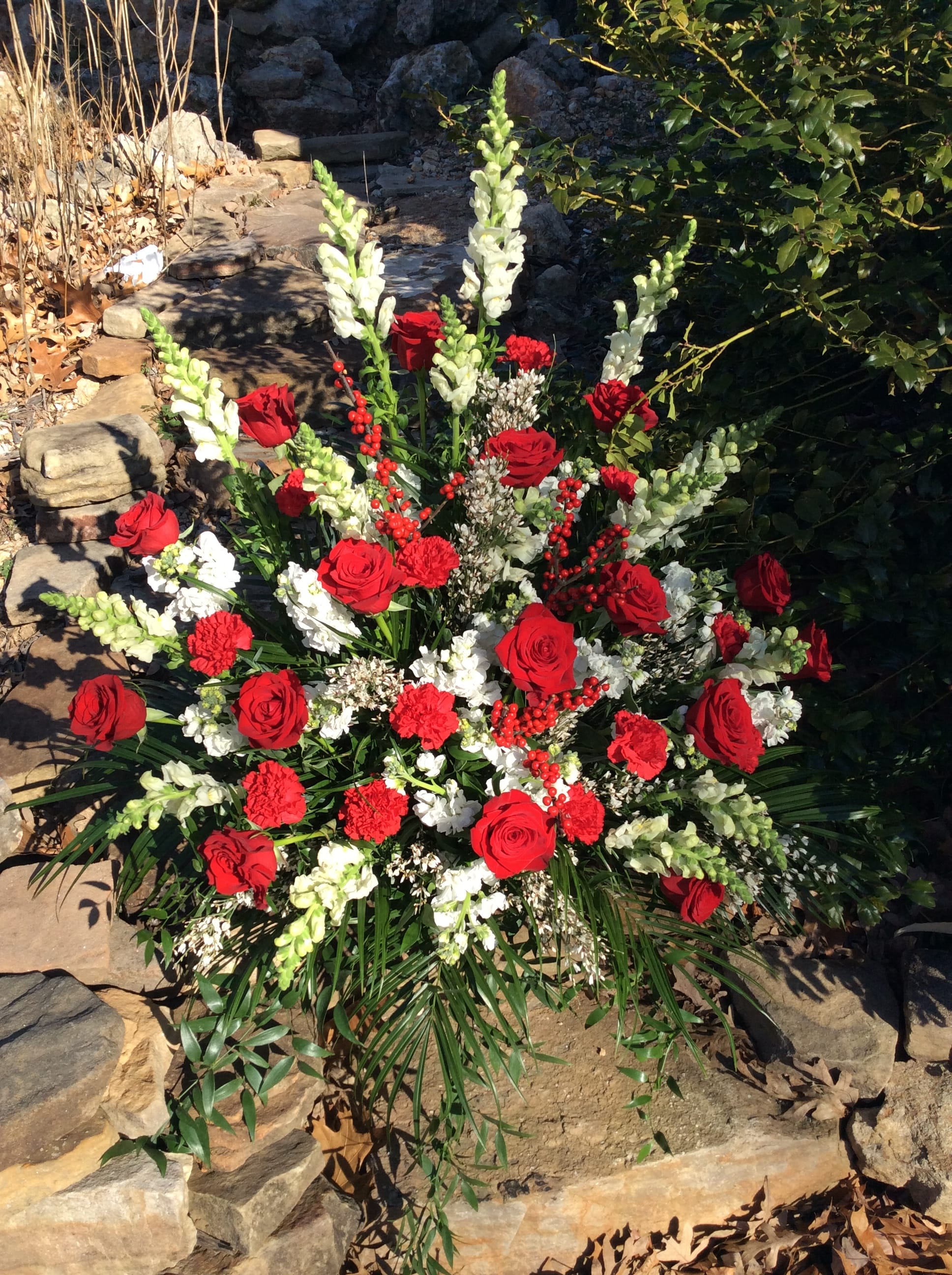 Traditional red and white premium sympathy basket - Traditional funeral basket arrangement filled with premium red and white florals. Some flowers may vary do to availability while maintaining the overall look and feel of the arrangement. 