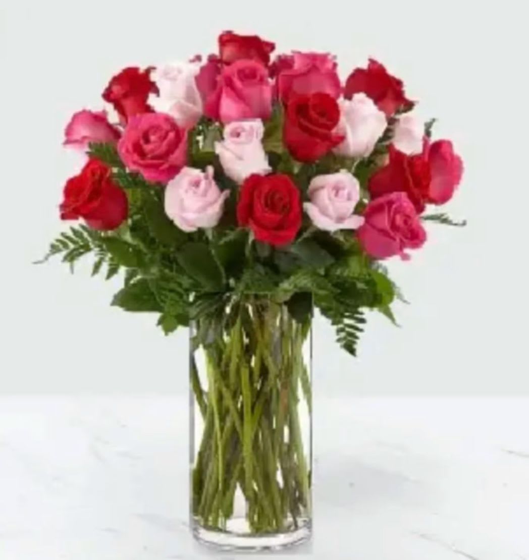 Rose Colored Love 24 - It's all in the name. This sweet arrangement is a soft and feminine combination of roses in three stunning shades. Each pink, hot pink and red bloom in our Rose Colored Love Bouquet is perfect for sending affection to a significant other or surprising a loved one with a gorgeous Valentine.
