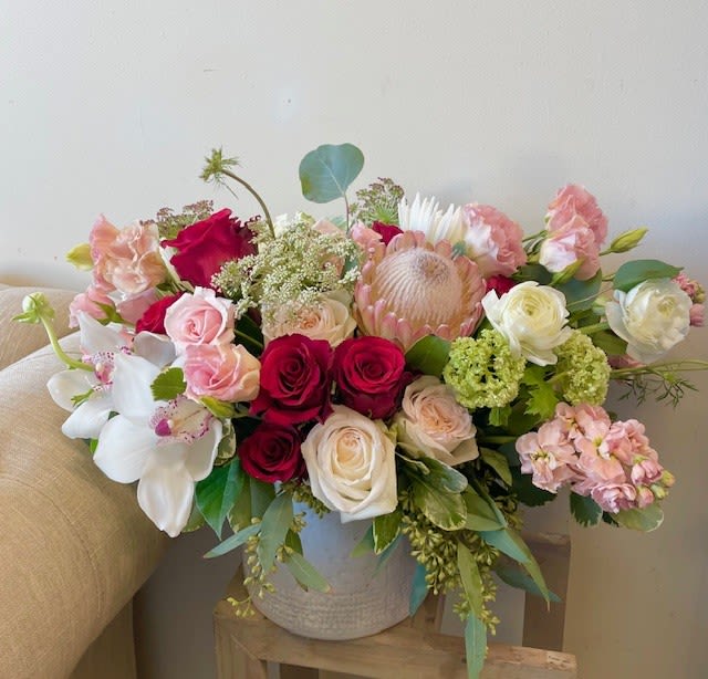 You're Beautiful  - Theme Colors: Shades of white, red and pink  Featured Blooms: Roses, Ranunculus, Orchids, Stocks, Lysianthus, China Mum, Eucalyptus, Dry Rice Flowers and greens  HK Flowers have a uniqueness of florals and seasonal blooms, certain flowers or colors may not be available as each season affects the availability, color, size, and shape of each floral bloom. Some flowers may be substituted accordingly.&nbsp;  Photos are used as a reference for the color palette and is NOT indicated of the final product. We ask for your trust in us that we will pick out the best seasonal available blooms, while still capturing the arrangements theme and colors mentioned above.