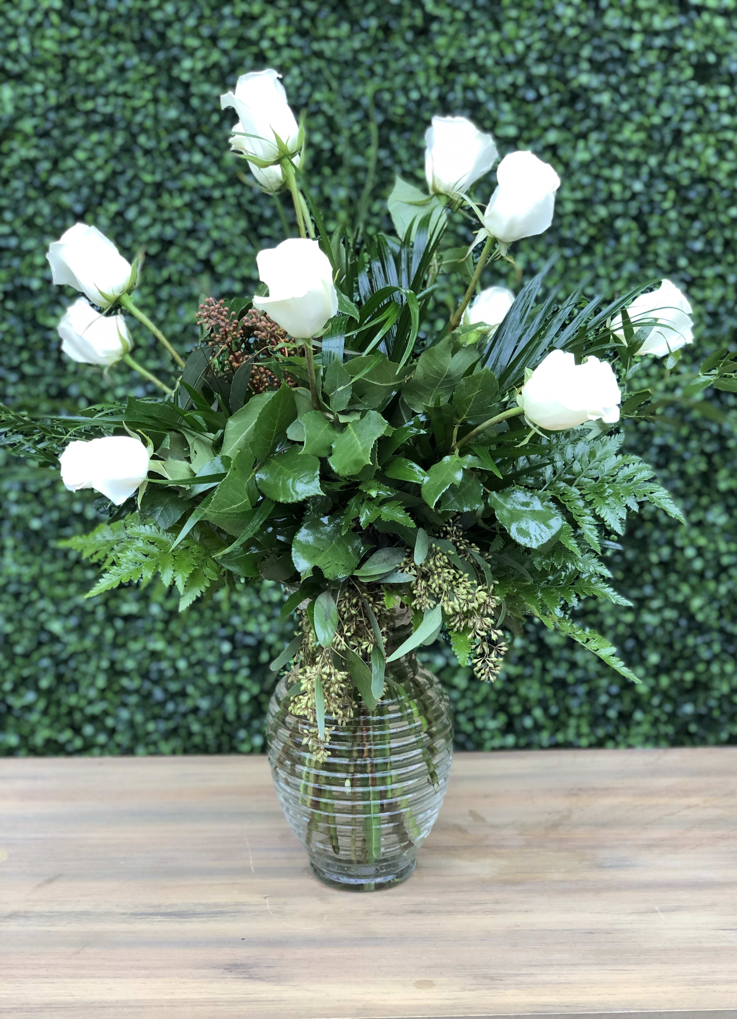 CLASSIC WHITE ROSES - This is Hirni's Classic One Dozen White Roses with green and filler in a nice glass vase.
