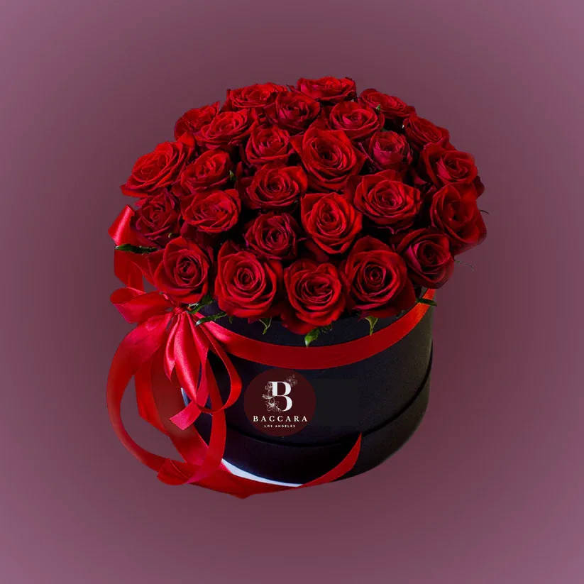 Scarlet Luxe: Red Rose Box Scarlet Luxe: Red Rose Box - Bold, passionate, and timeless — our Scarlet Luxe Rose Box is a breathtaking arrangement of fresh, handpicked red roses designed to make a lasting impression. Perfect for romantic gestures, anniversaries, birthdays, or simply to say “I love you”, this luxurious rose box radiates elegance and heartfelt emotion. Choose your desired size — from an intimate collection to a lavish, grand display. Every rose is carefully selected for its rich crimson hue and velvety texture, beautifully arranged in a modern, elegant box to create a striking and unforgettable gift. Highlights: ️ Hand-selected, premium red roses arranged in a chic box ️ Available in multiple sizes — pick the perfect one for your moment ️ Ideal for romance, anniversaries, and grand surprises ️ Optional personalized message card and luxury wrapping Express your deepest emotions with the timeless beauty of red roses, beautifully boxed and ready to impress. Disclaimer: Product images are for reference only. Actual flower shades, box colors, and arrangement styles may vary slightly based on seasonal availability and stock. We always strive to match the overall style, color palette, and quality shown in the photos, ensuring every arrangement is fresh, beautiful, and thoughtfully curated.