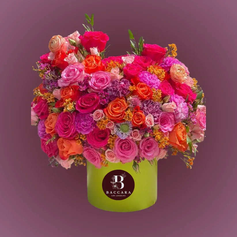 Summer Sunset: Orange & Pink Flower Arrangement Summer Sunset: Orange & Pink Flower Arrangement - Capture the essence of a summer sunset with our vibrant orange and pink flower arrangement! Bursting with zinnias, peonies, and cheerful marigolds, this stunning display radiates warmth and joy. Each bloom is carefully selected to evoke the bright colors of summer evenings, perfect for brightening your space or celebrating a special occasion. Bring a splash of summer bliss into your life with this delightful arrangement that embodies the spirit of sunshine and laughter! Disclaimer: Product images are for reference only. Actual flower shades, box colors, and arrangement styles may vary slightly based on seasonal availability and stock. We always strive to match the overall style, color palette, and quality shown in the photos, ensuring every arrangement is fresh, beautiful, and thoughtfully curated.