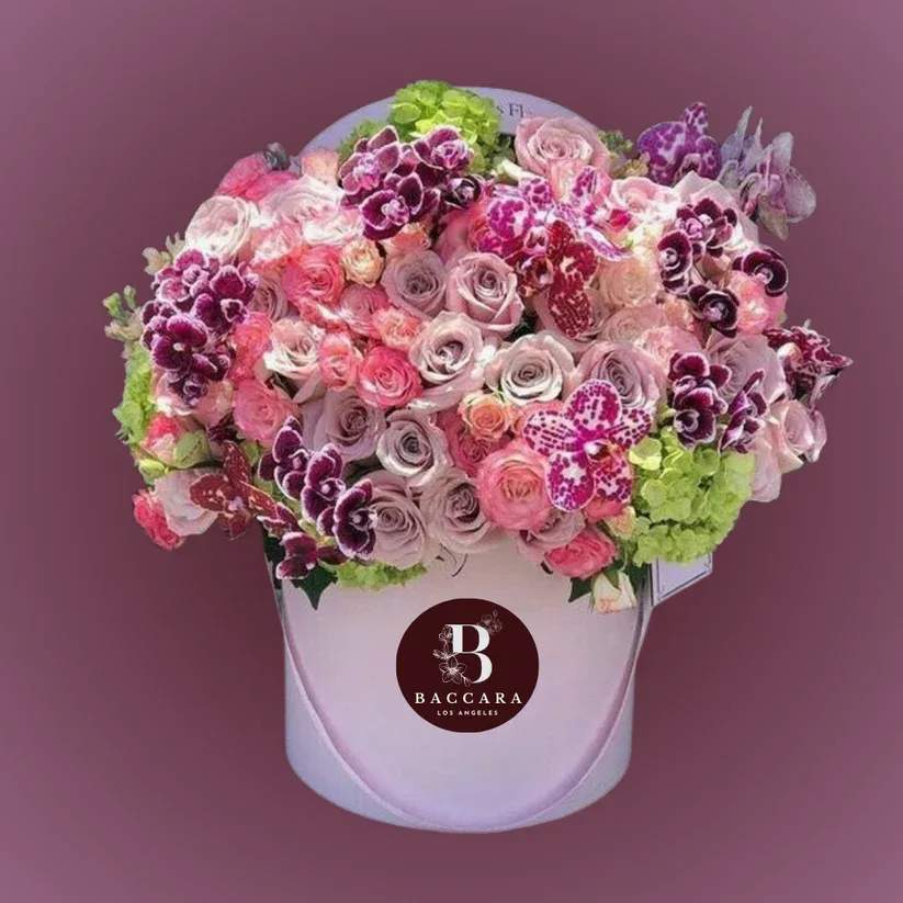 Spring Serenity: Pink, Purple & Lavender Floral Arrangement Spring Serenity: Pink, Purple & Lavender Floral Arrangement - Welcome the beauty of spring with our Spring Serenity floral arrangement! This exquisite display features a harmonious blend of soft pinks, rich purples, and delicate lavenders, showcasing blooms like lilacs, peonies, and hyacinths. Each flower is thoughtfully arranged to create a soothing yet vibrant atmosphere, perfect for brightening your home or as a lovely gift for a loved one. Celebrate the season of renewal and joy with this stunning arrangement that captures the essence of spring in every petal! Disclaimer: Product images are for reference only. Actual flower shades, box colors, and arrangement styles may vary slightly based on seasonal availability and stock. We always strive to match the overall style, color palette, and quality shown in the photos, ensuring every arrangement is fresh, beautiful, and thoughtfully curated.