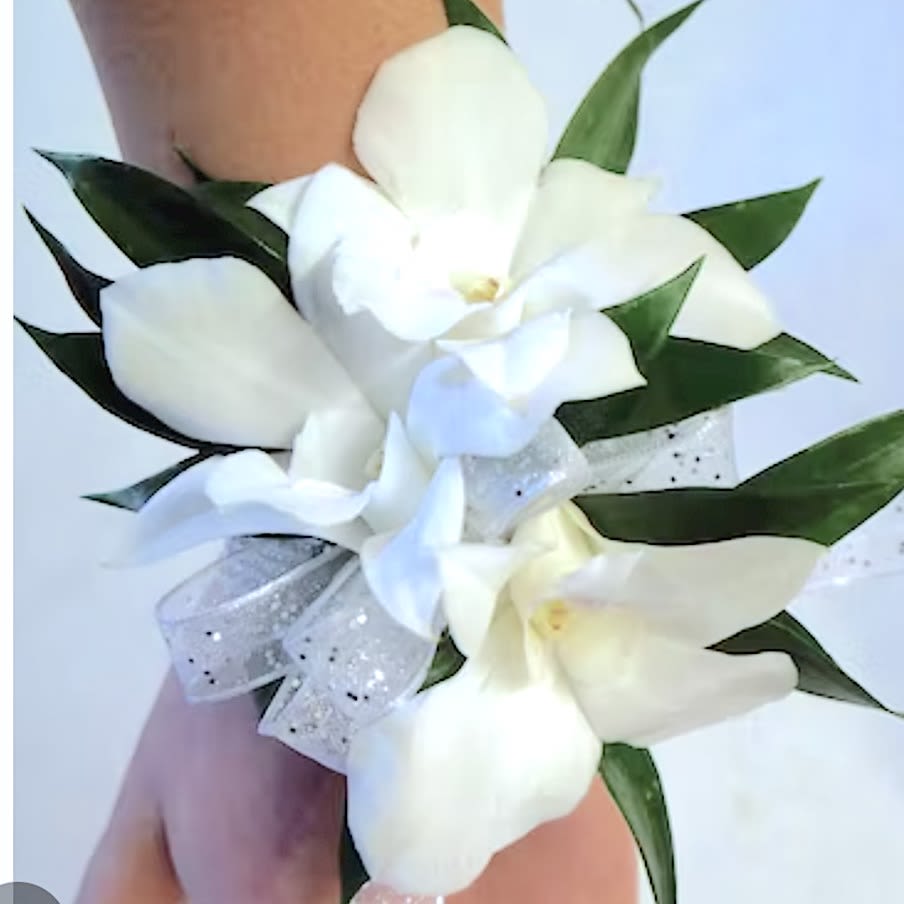 White Dendrobium Orchid Prom Wrist - A stunning fresh flower wrist corsage made of delicate Dendrobium Orchids, accent flowers, ribbon, and rhinestones set upon an elastic wrist band.