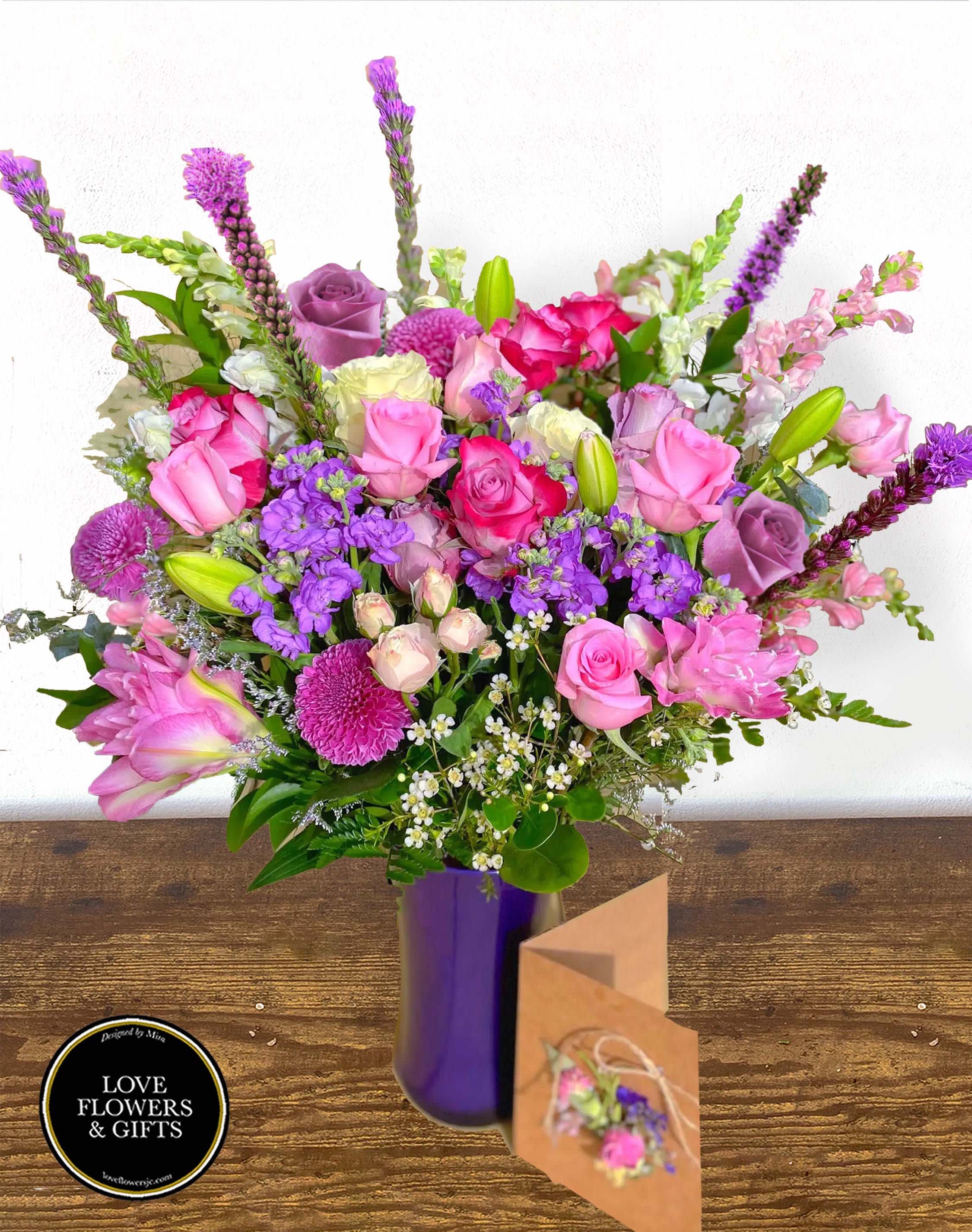 Violets Galore (with Handmade Card)  - Made of purple, pink, white roses, lilies, and other flowers of lots of various textures, beautiful. abundant, and tall arrangement in a high-quality violet glass vase.   Comes with a complimentary hand-made dried flower card 5x7 with your message written in it.*Each Card is unique 