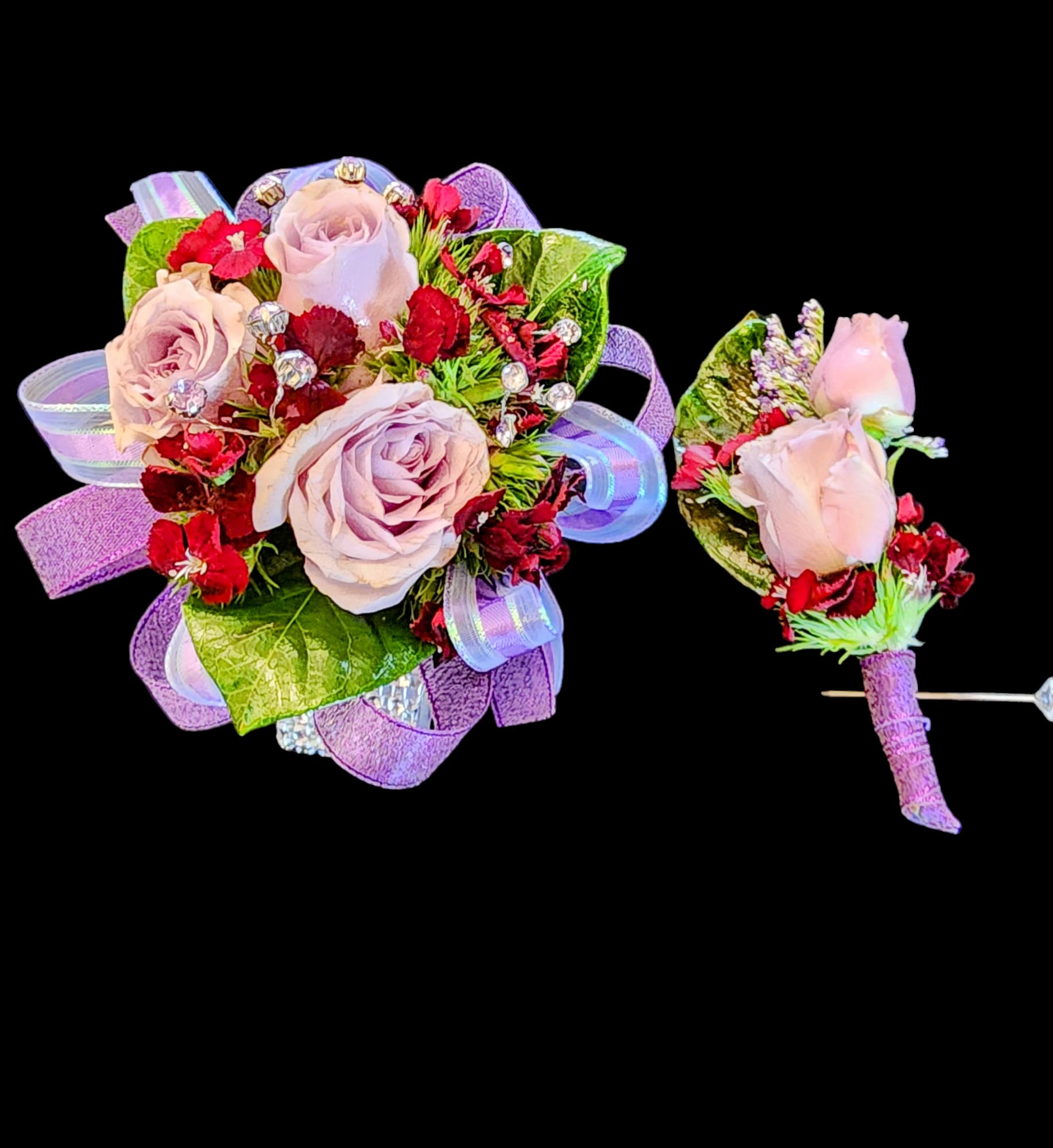 Corsage &amp; boutonniere in Pink &amp; Lavender - This duo is designed using pink roses, with lavender and red accents.