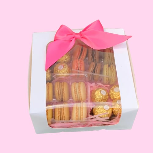Sweet Treat Box - Box of tasty chocolates and delicious Macaroons beautifully wrapped in our lovely bakers box topped with a silk ribbon bow making this an elegant gift to add to any flower arrangements. 