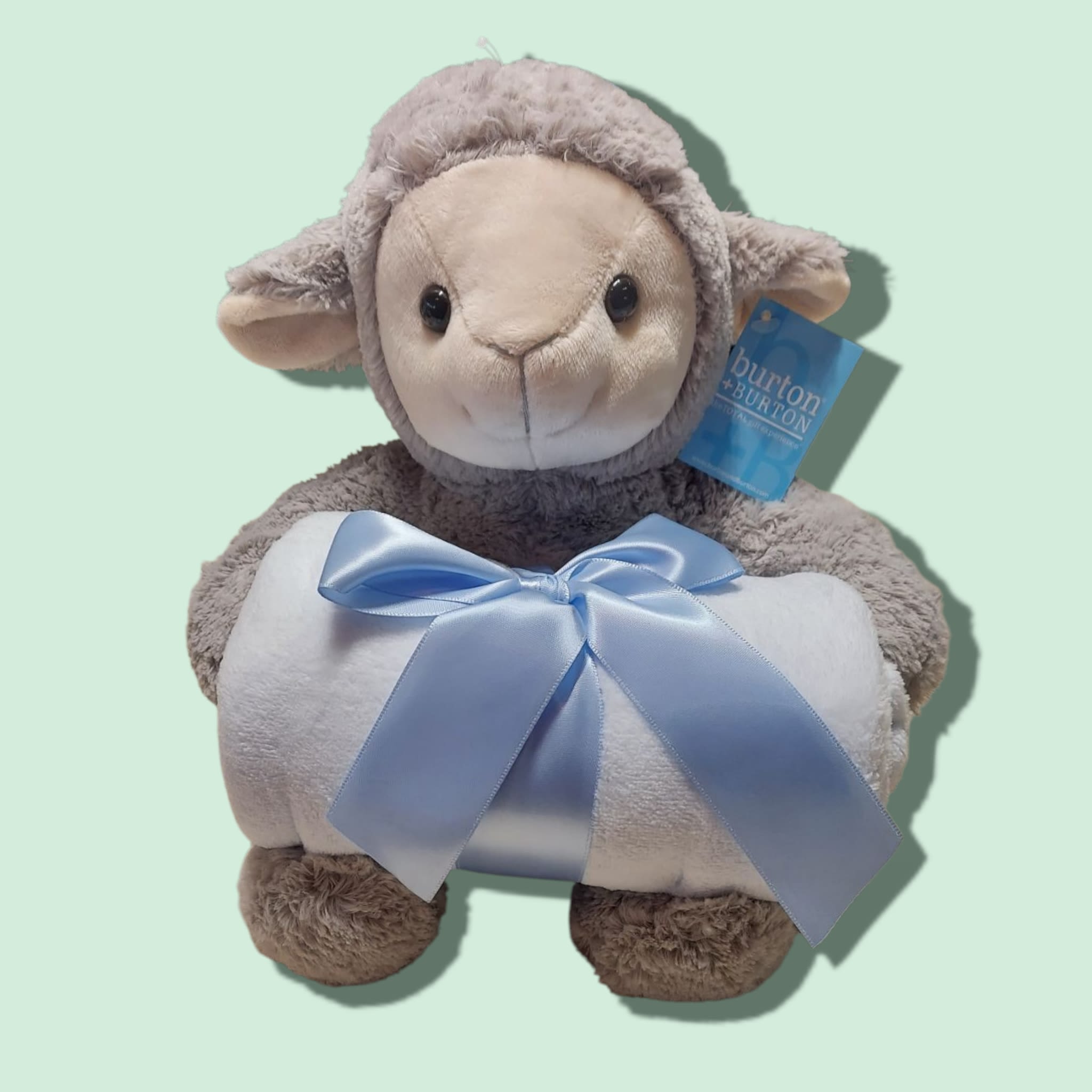 Plush Gray Lamb with Blue Blanket - Gray lamb with a cream colored face. There is a rolled up blue fleece blanket sitting on the lap of the lamb with a blue satin bow.  10 1/2&quot; sitting. 38&quot;H X 30&quot;D Blanket