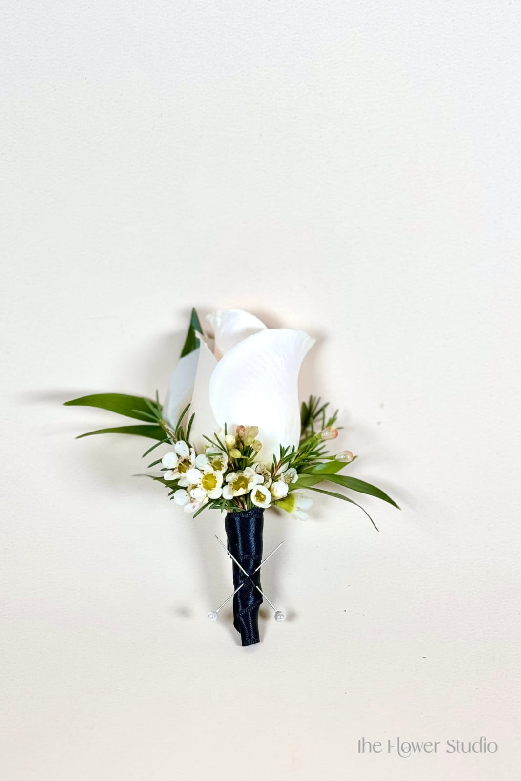Single Boutonniere - Traditional rose boutonniere - white or red, with ribbon matching. Fillers and greens included. Order yours today! 