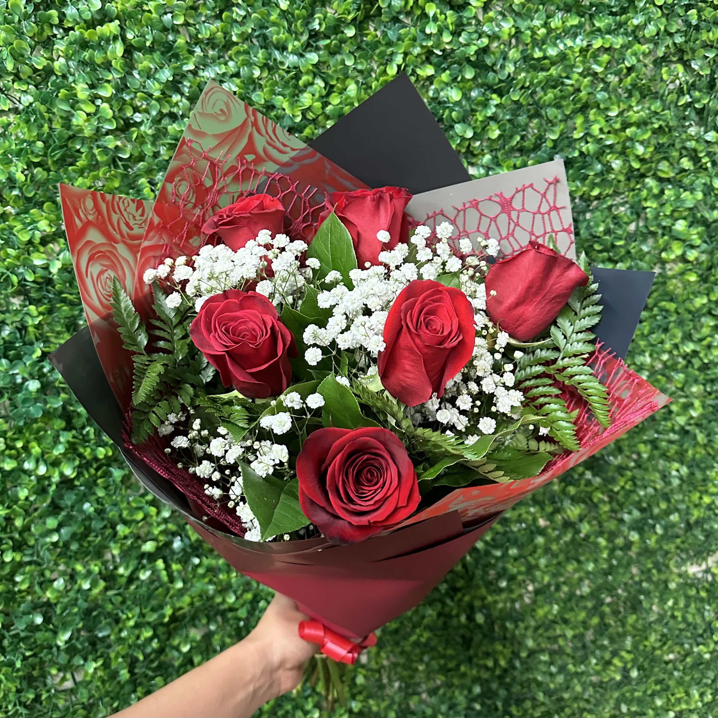 Half a Dozen Bouquet Wrap - 6 premium Red Roses wrapped with baby’s breath and foliage. Wrapped with beautiful paper. *wrap color will vary* 