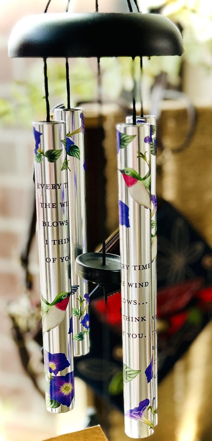 Think of You Wind Chime Think of You Wind Chime - "Every time the wind blows...I think of you." This wind chime is a smaller version of our larger memorial chimes. It comes decorated with a humming bird, morning glory, and with the poem inscribed on it.