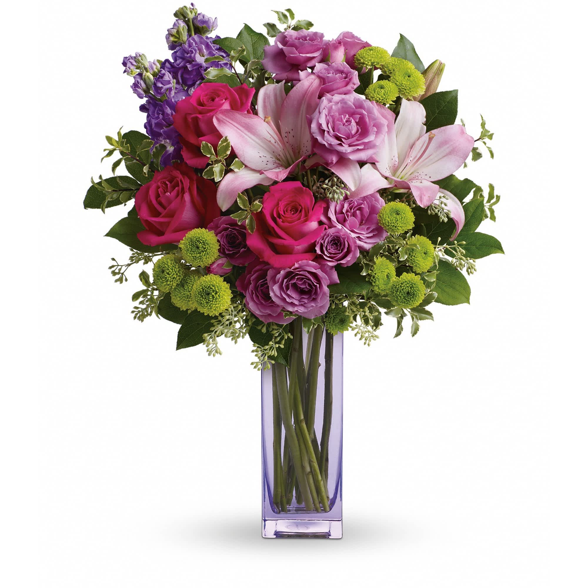 Teleflora's Fresh Flourish Bouquet - Color them happy with this bold, beautiful mix of hot pinks, flirty lavenders, and lime greens! Hand-delivered in a lavender glass vase, this posh present pampers your loved one on a special day - or any day at all!  